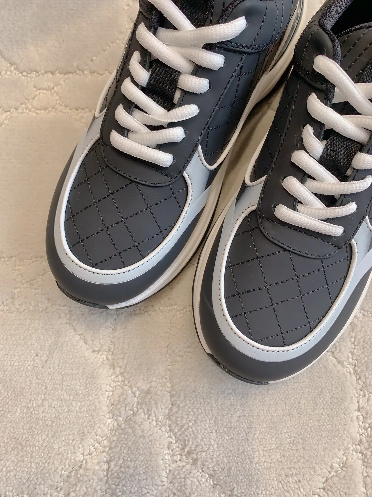 Chanel Quilted Sneakers in Black · view 5