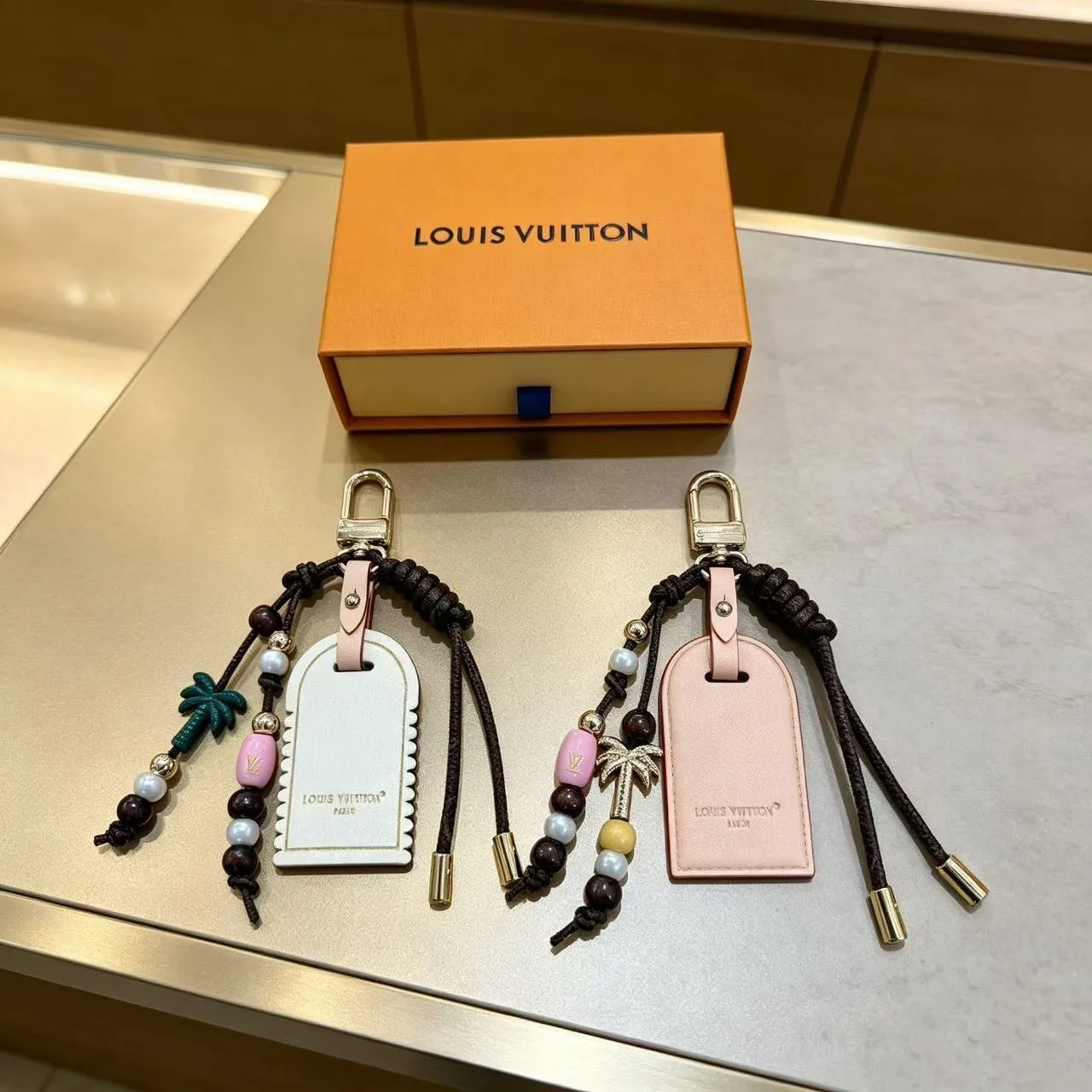 Louis Vuitton Luggage Tag Keychain in White & Pink · view 1