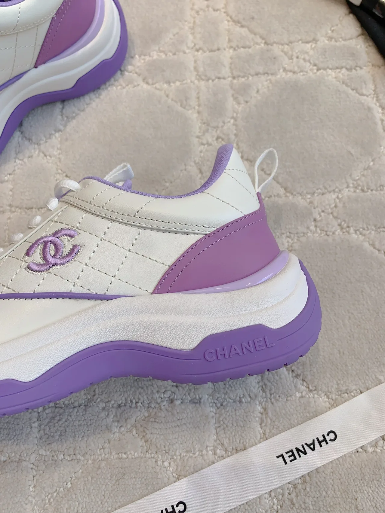 Chanel Quilted Sneakers in White · view 7