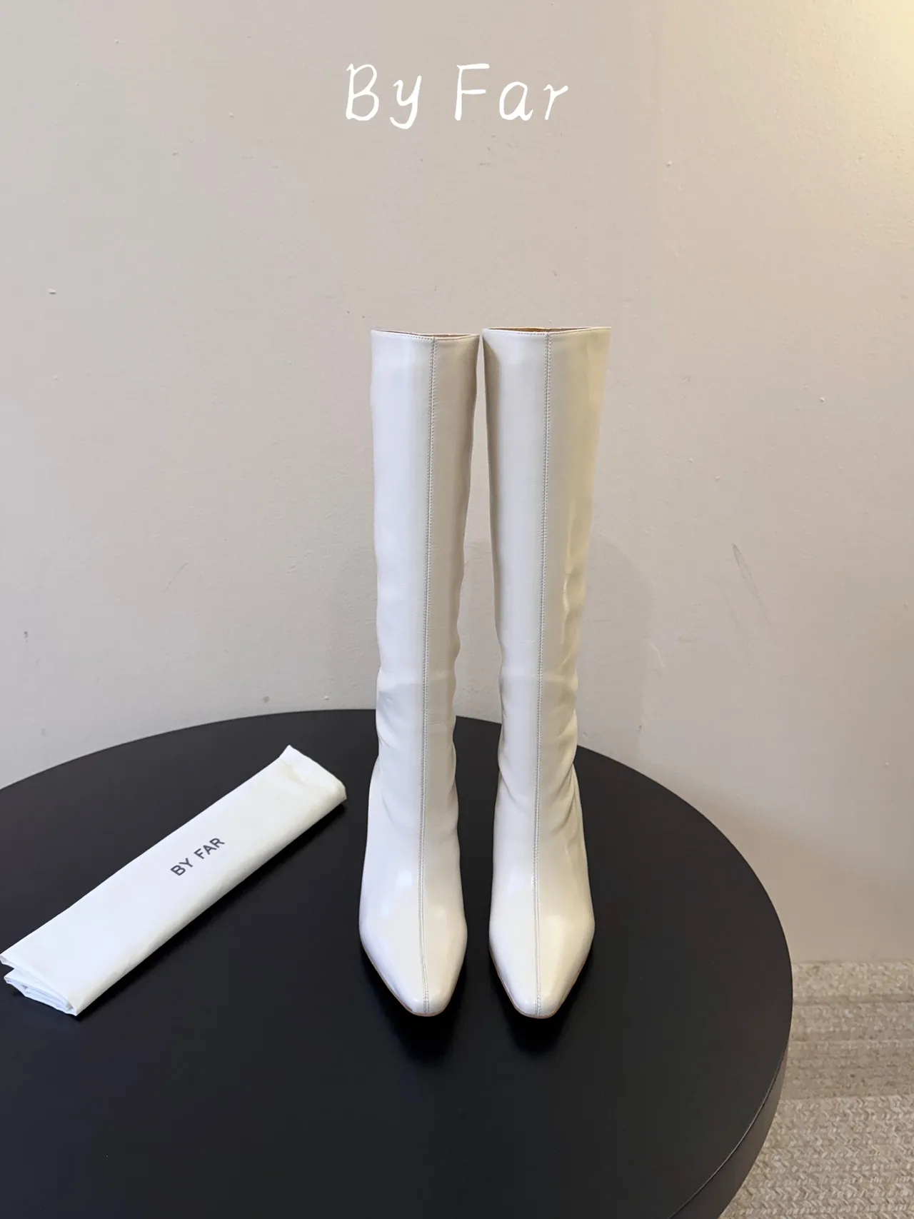 By Far Glossy Pointed-Toe Knee-High Boots in White · view 1
