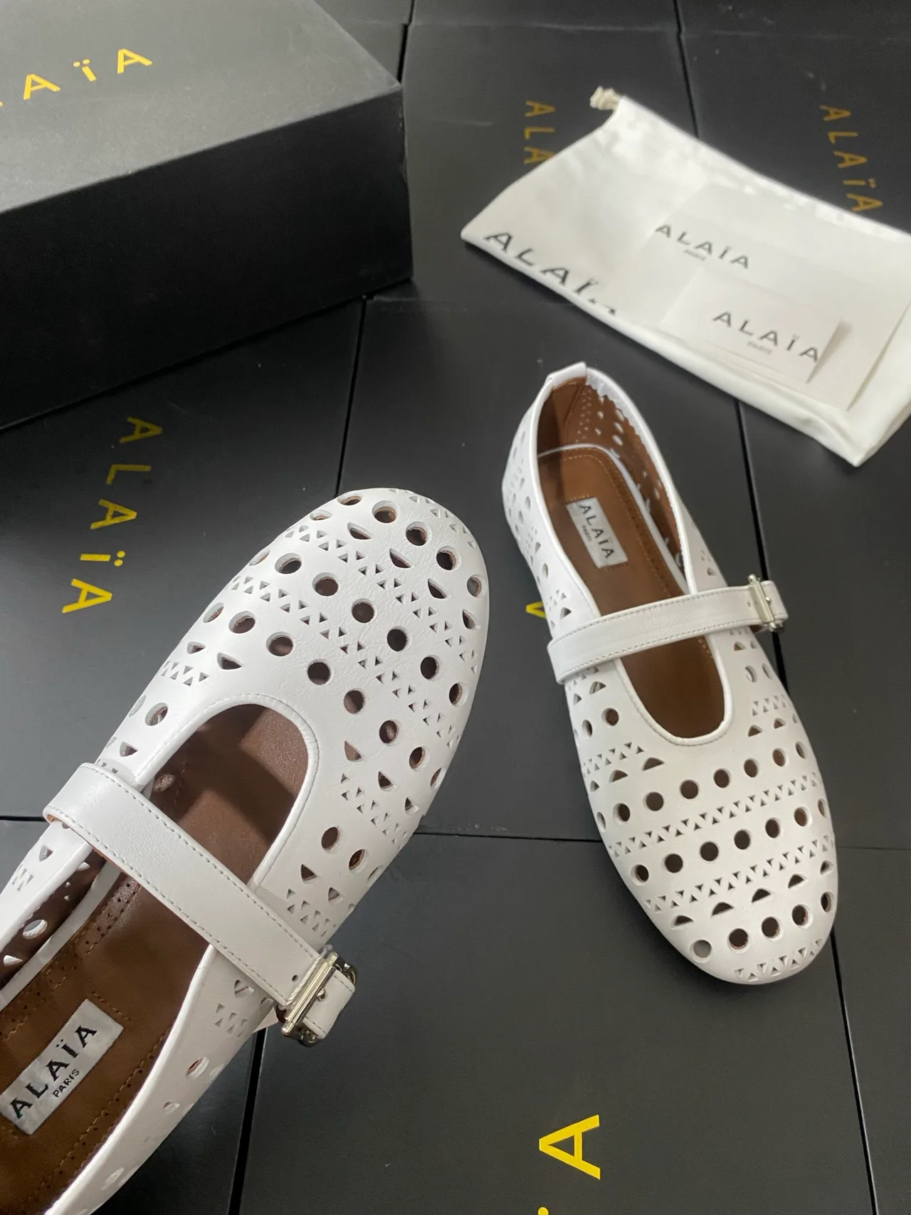 Alaia Cowhide Sheepskin Round-Toe Buckle Ballet Flats in White · view 8
