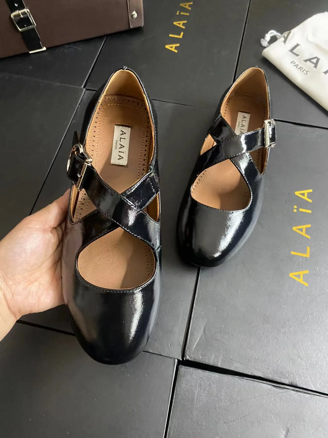 Alaia Cowhide Sheepskin Glossy Square-Toe Buckle Cross-Strap Flats in Black · view 7