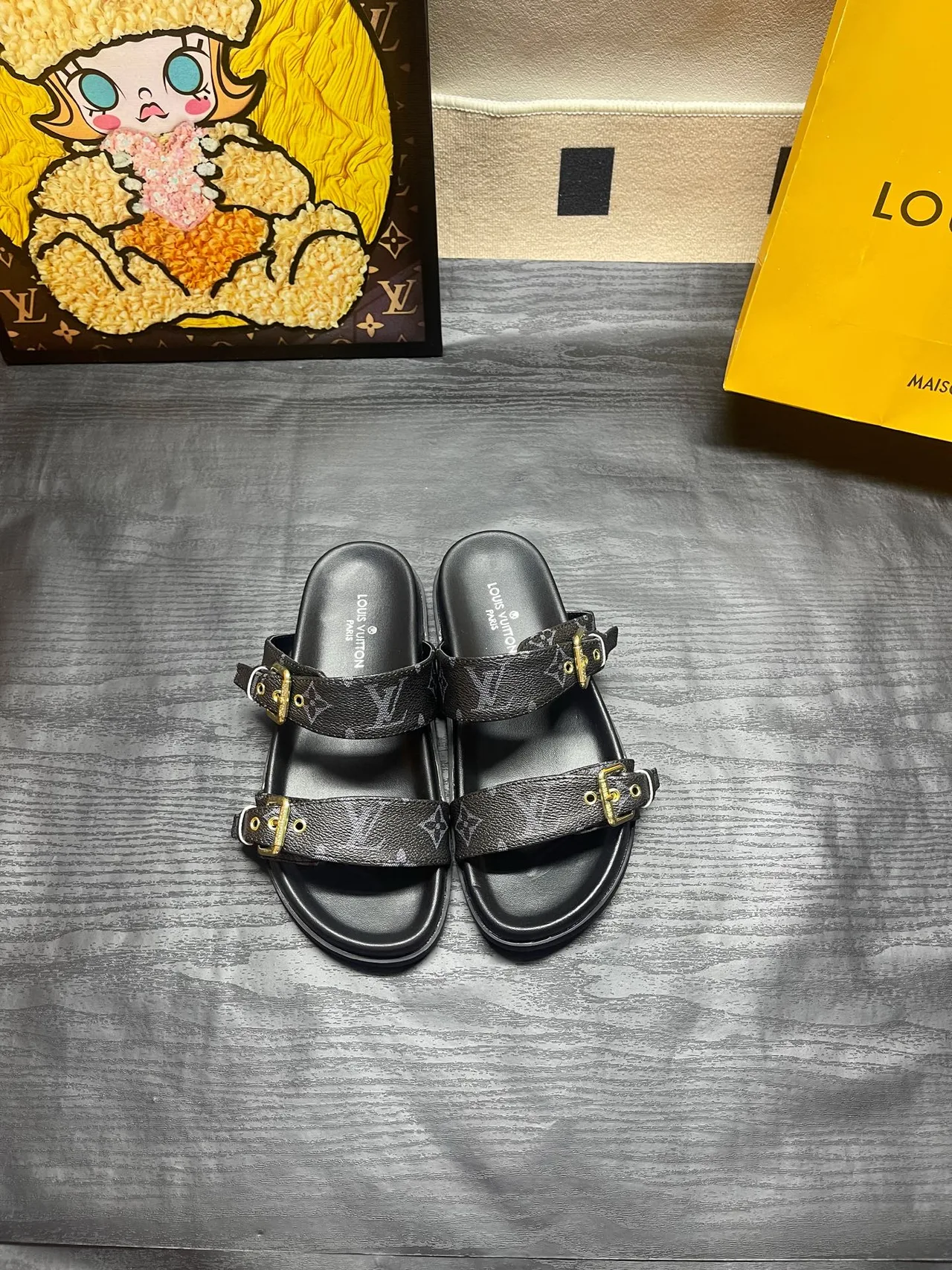 Louis Vuitton Double-strap monogram slides in Black / Brown · view 1