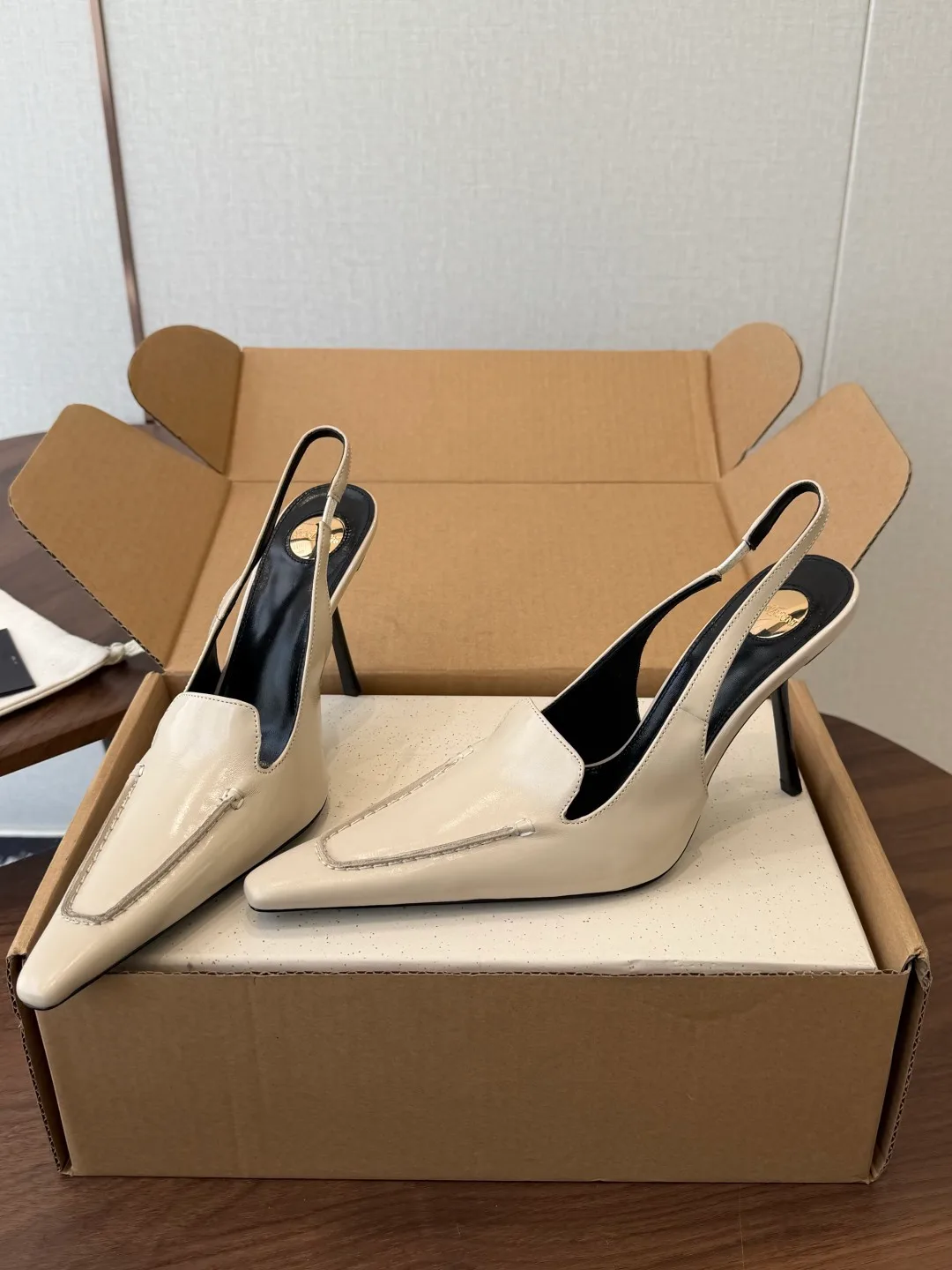 Saint Laurent Cowhide Pointed-Toe Slingback Shoes in Cream · view 2