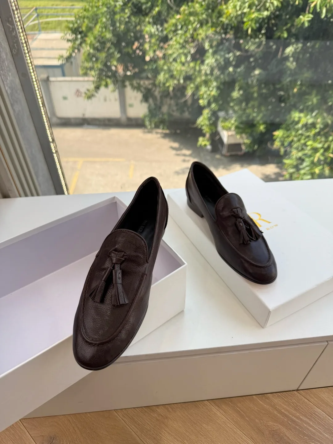 The Row Cowhide Glossy Round-Toe Tassel Loafers in Brown · view 3