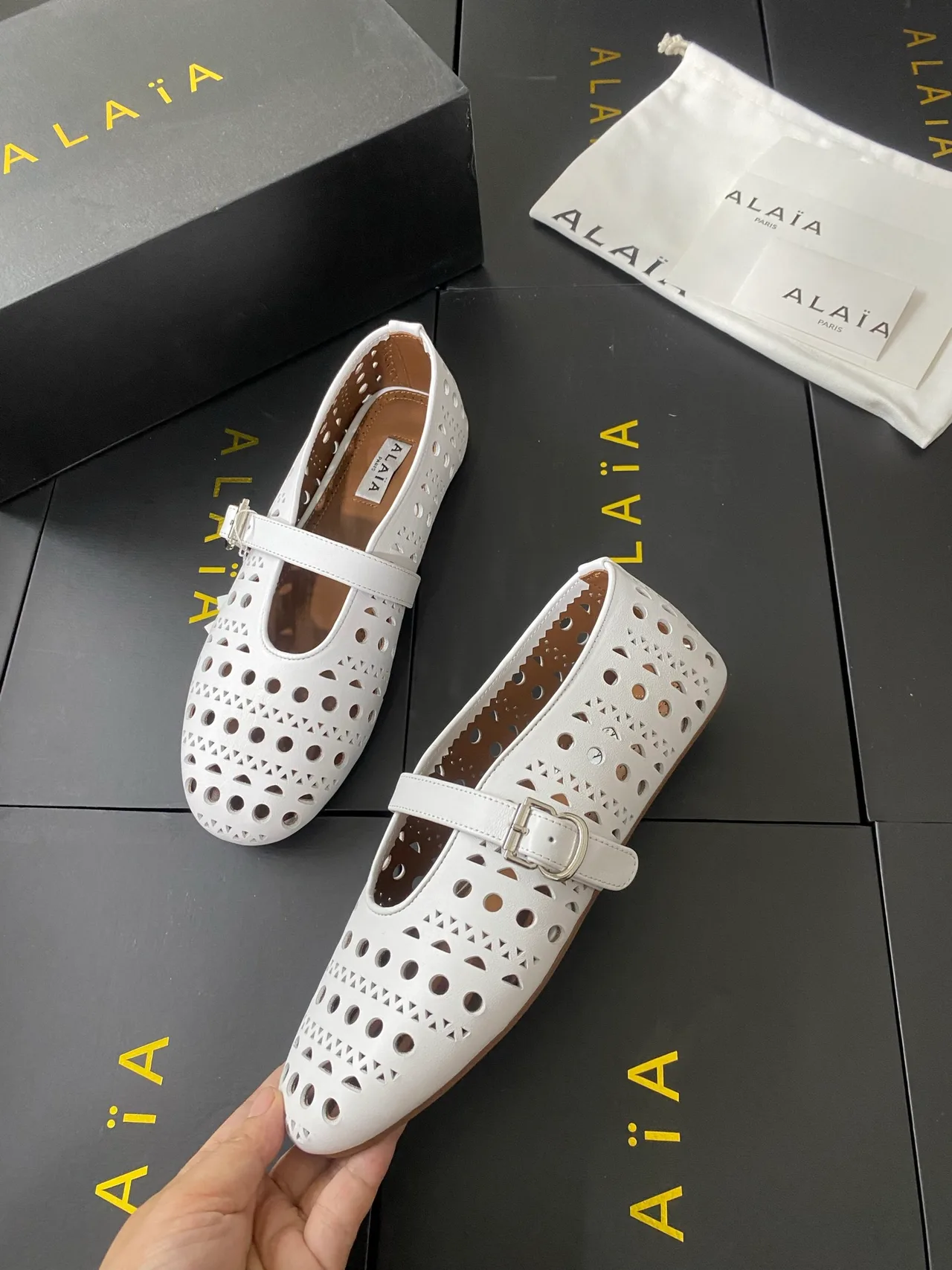 Alaia Cowhide Sheepskin Round-Toe Buckle Ballet Flats in White · view 6