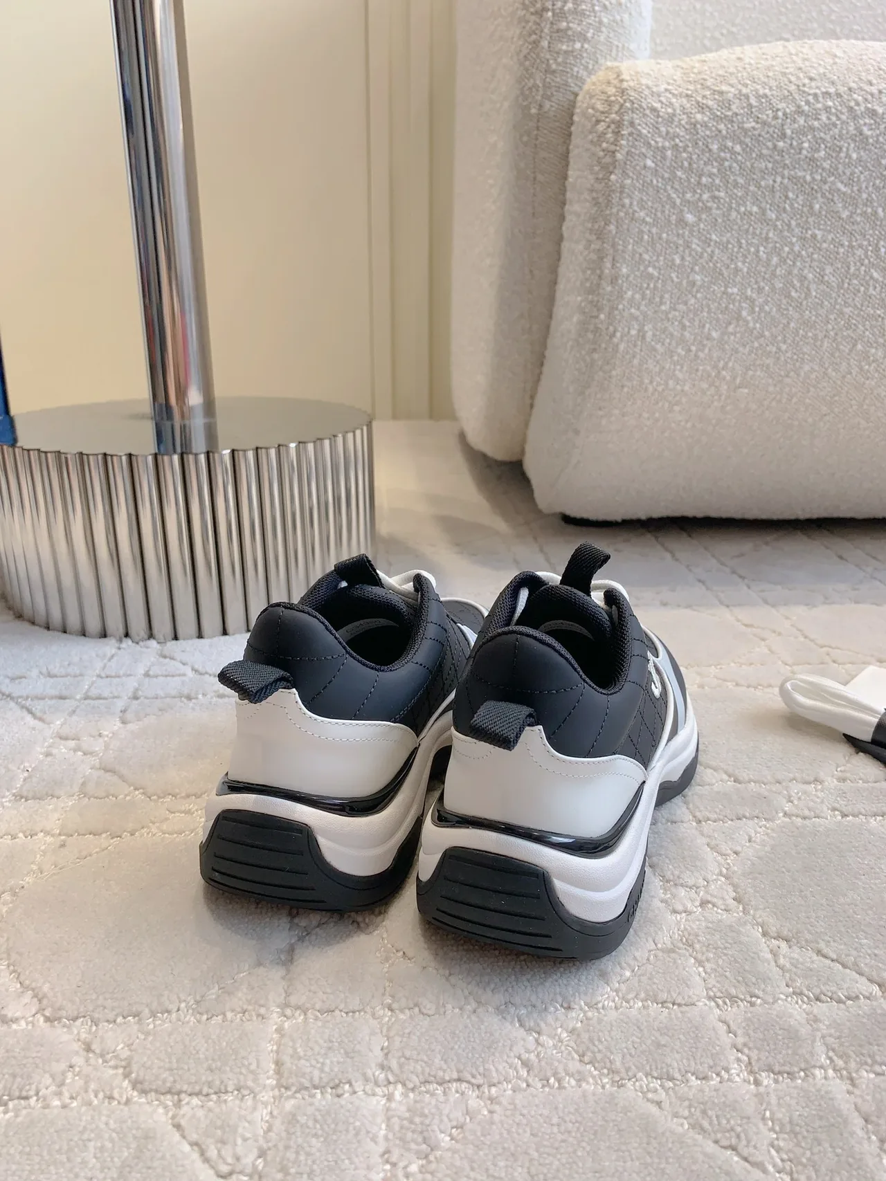 Chanel Quilted Sneakers in Black · view 8