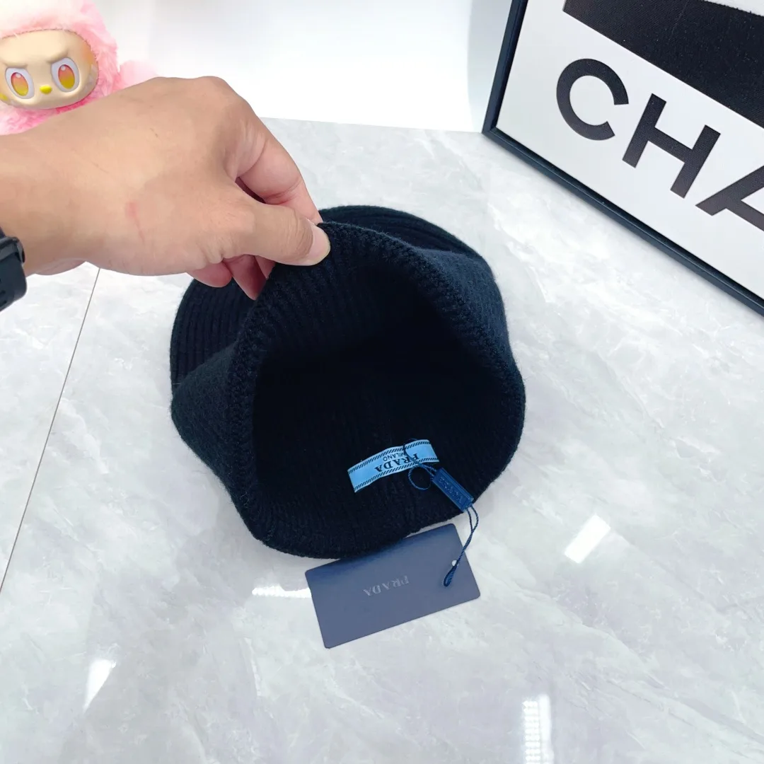 Prada Triangle-Badge Beanie in Black & Grey & White & Beige & Brown & Yellow & Blue & Pink & Red · view 11