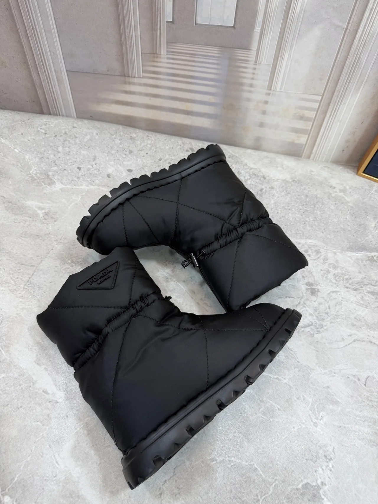 Prada Puffer Boots in Black · view 3