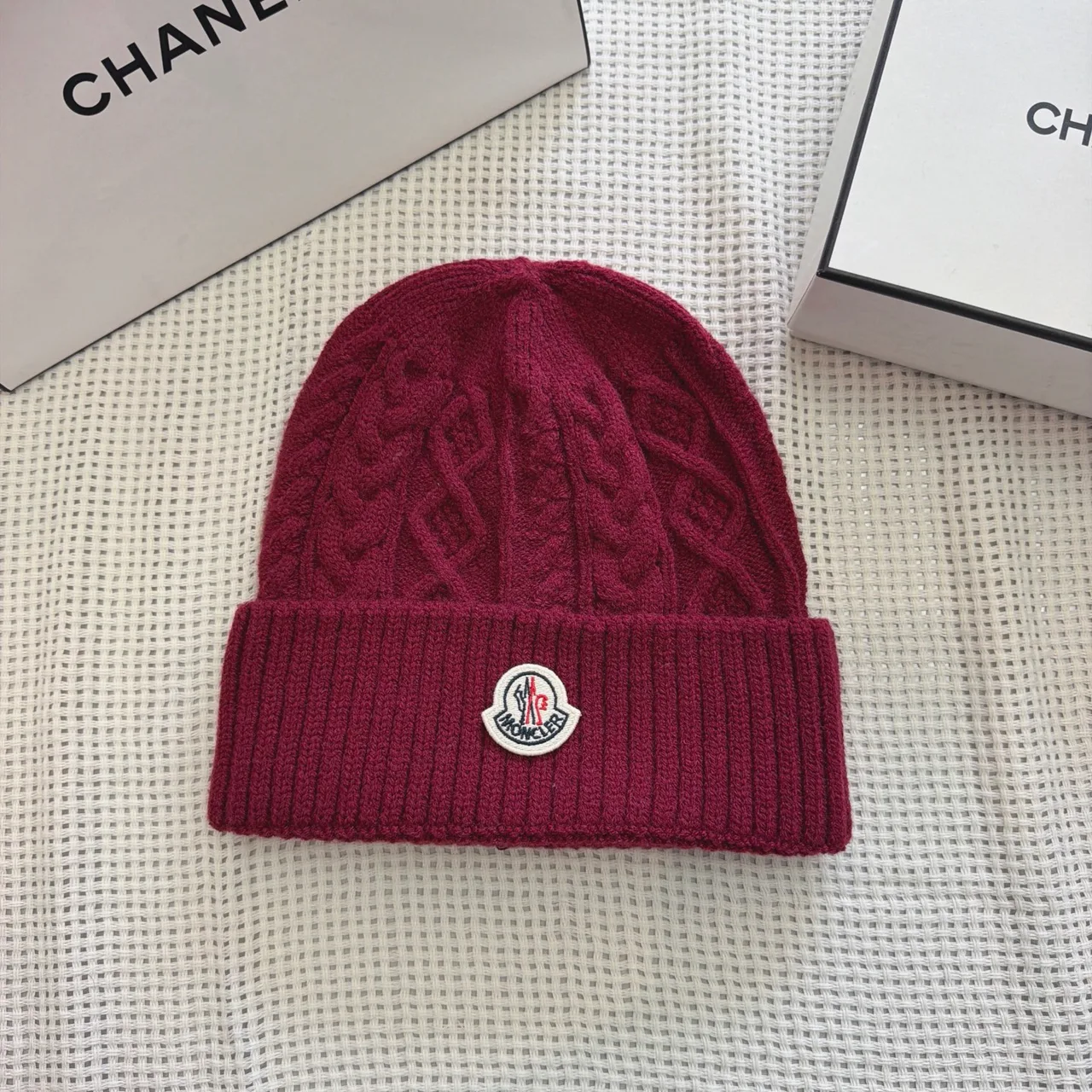 Moncler Cable-knit logo beanie in Burgundy & Black & White & Cream & Grey & Tan · view 1