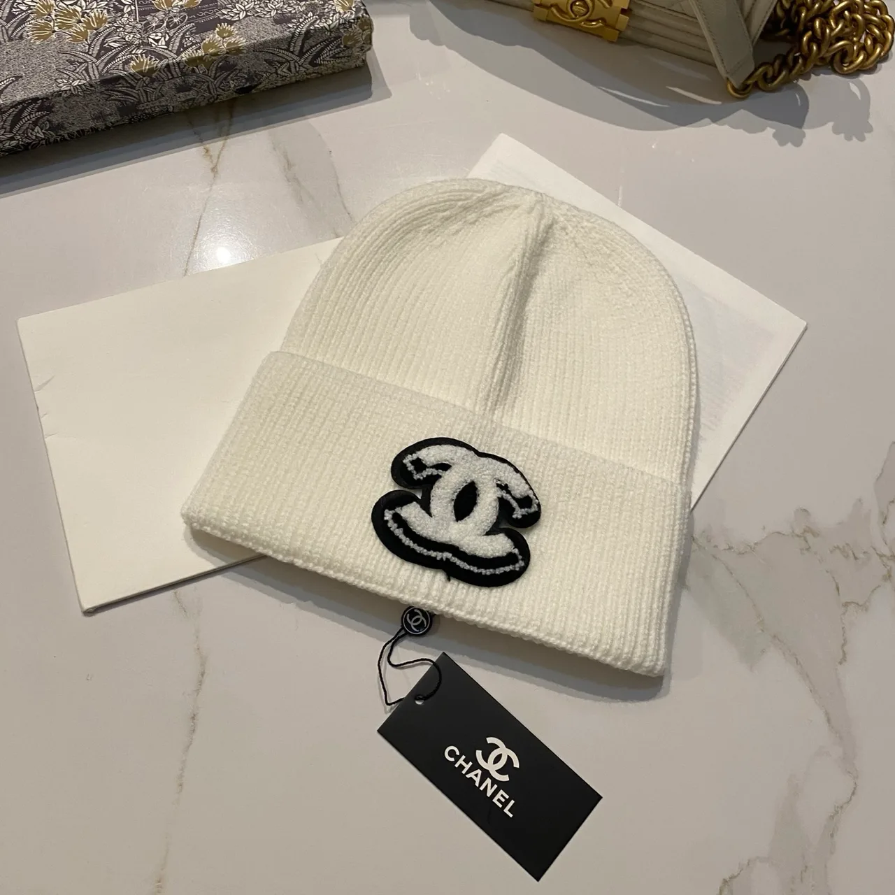 Chanel CC knit beanie in Black / White / Red / Grey / Beige / Tan · view 2