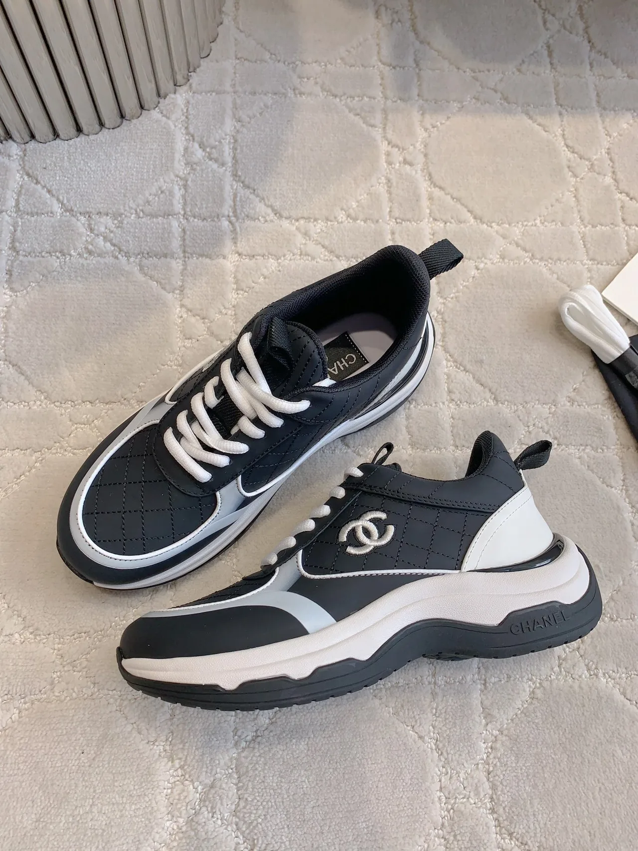Chanel Quilted Sneakers in Black · view 4