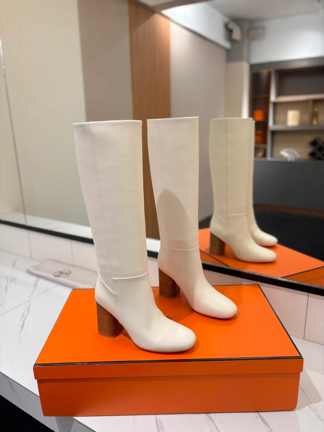 Hermes Cowhide Matte Round-Toe Knee-High Boots in White · view 1