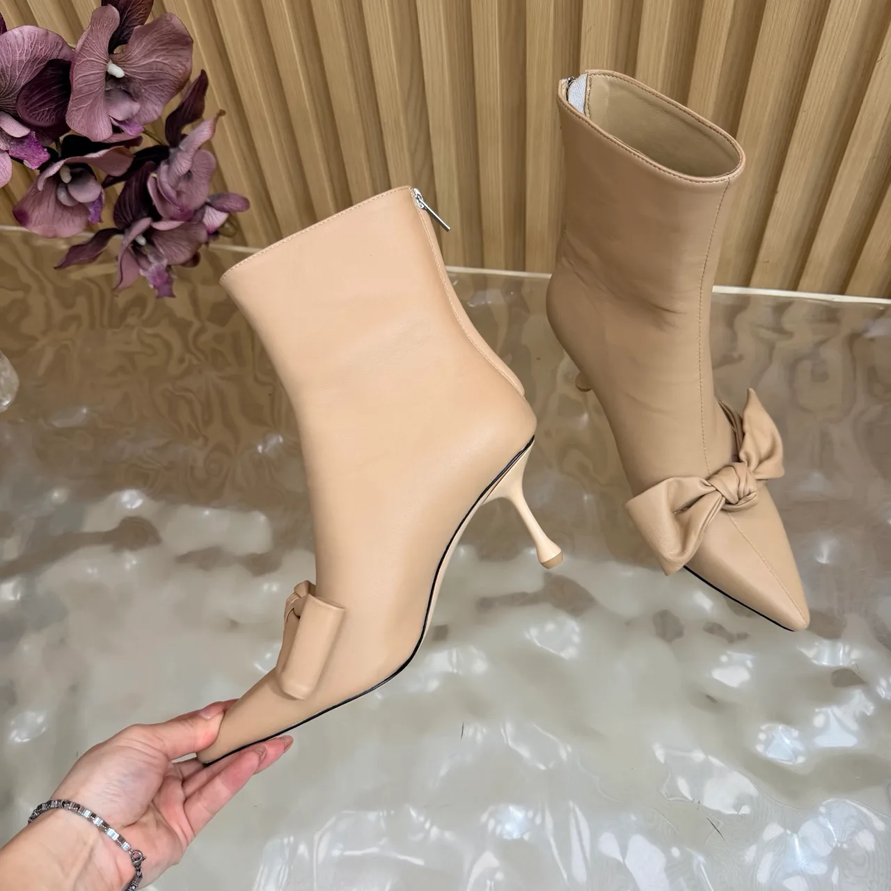 Jimmy Choo Cowhide Glossy Pointed-Toe Bow Ankle Boots in Beige · view 8