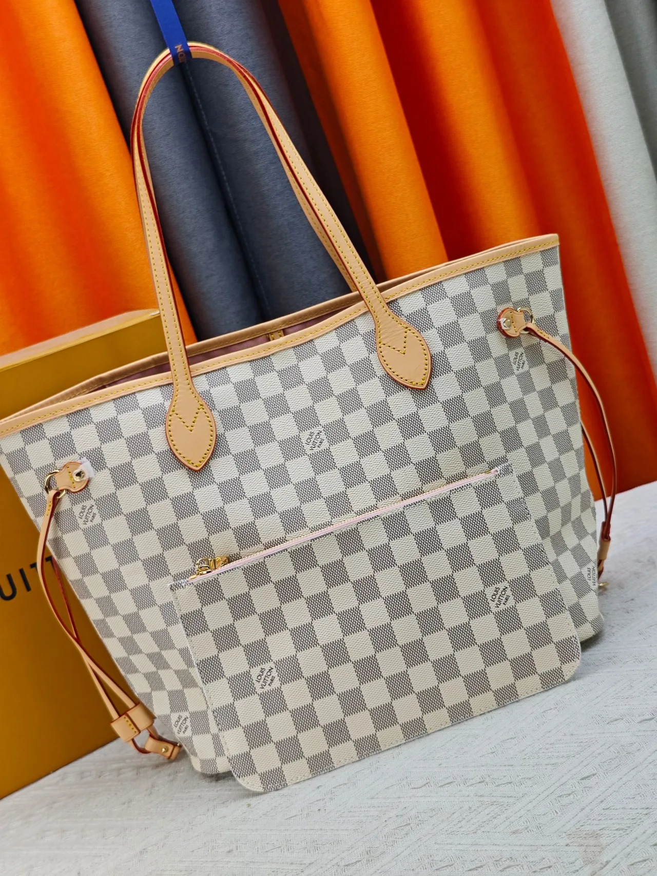 Louis Vuitton Neverfull Clutch in Grey · view 1