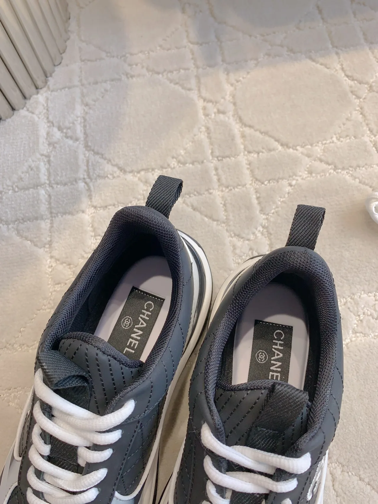 Chanel Quilted Sneakers in Black · view 6