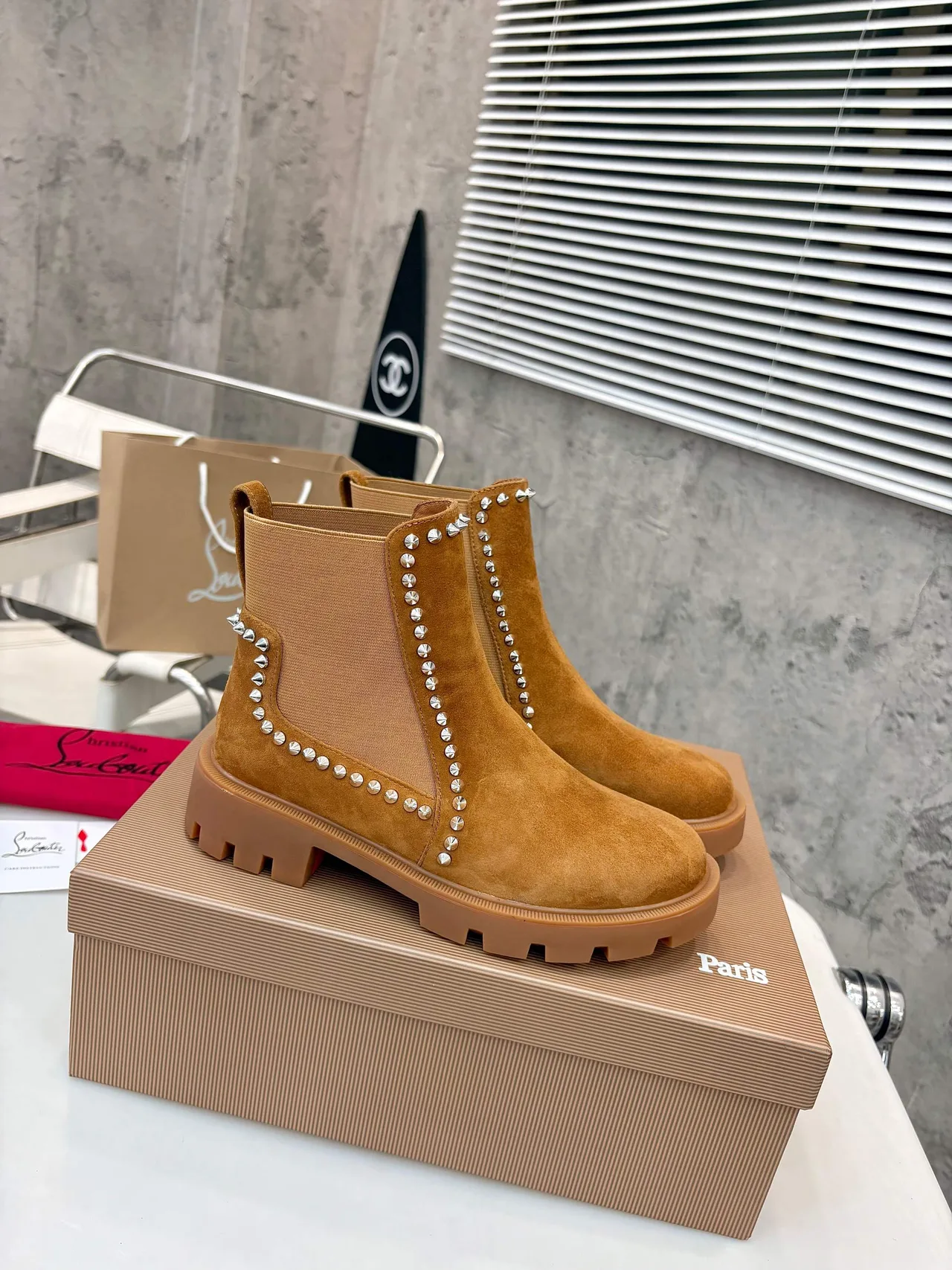 Christian Louboutin Stud-trim ankle boots in Black & Tan · view 2