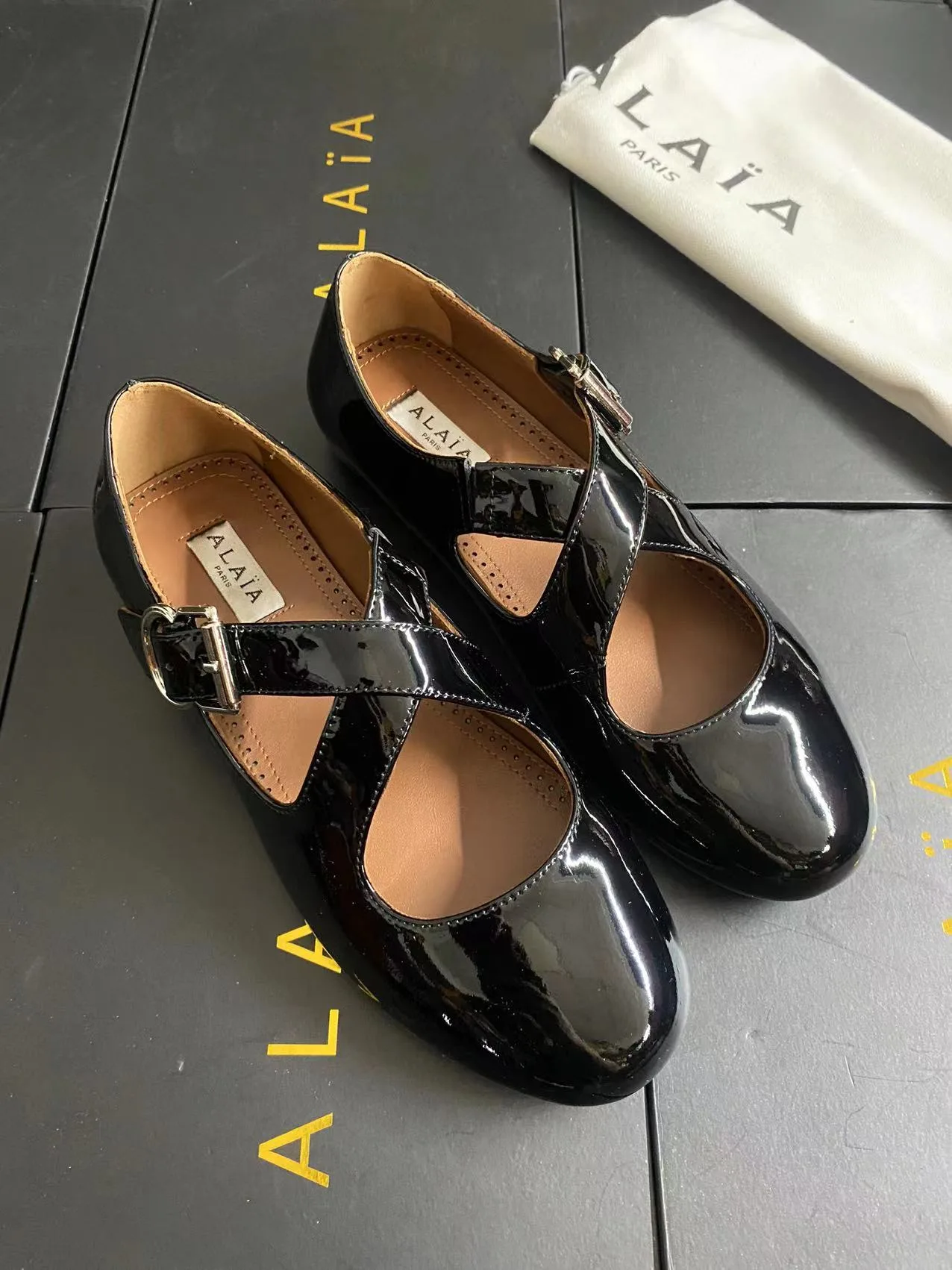 Alaia Cowhide Sheepskin Glossy Square-Toe Mary Jane Flats in Black · view 2