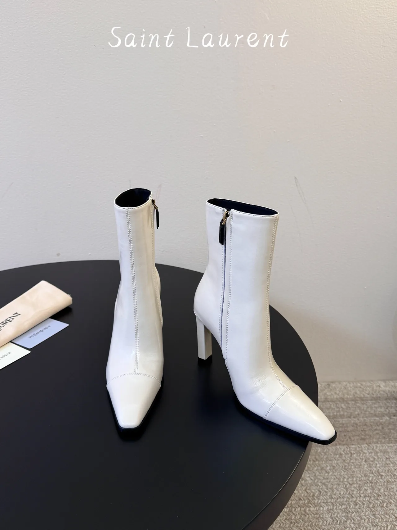 Saint Laurent Glossy Pointed-Toe Ankle Boots in White · view 2