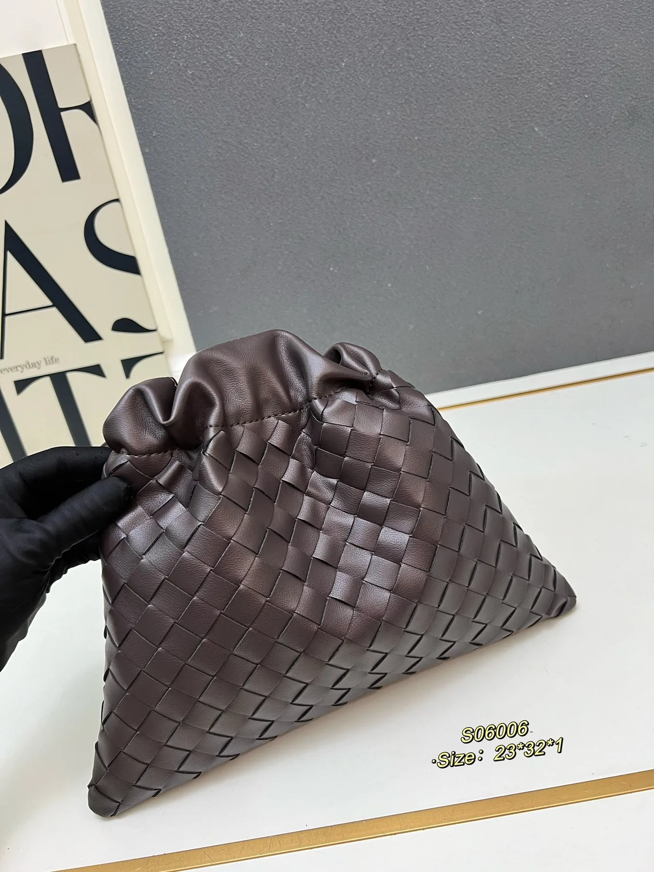 Bottega Veneta Smooth Woven Drawstring Pouch in Brown · view 1