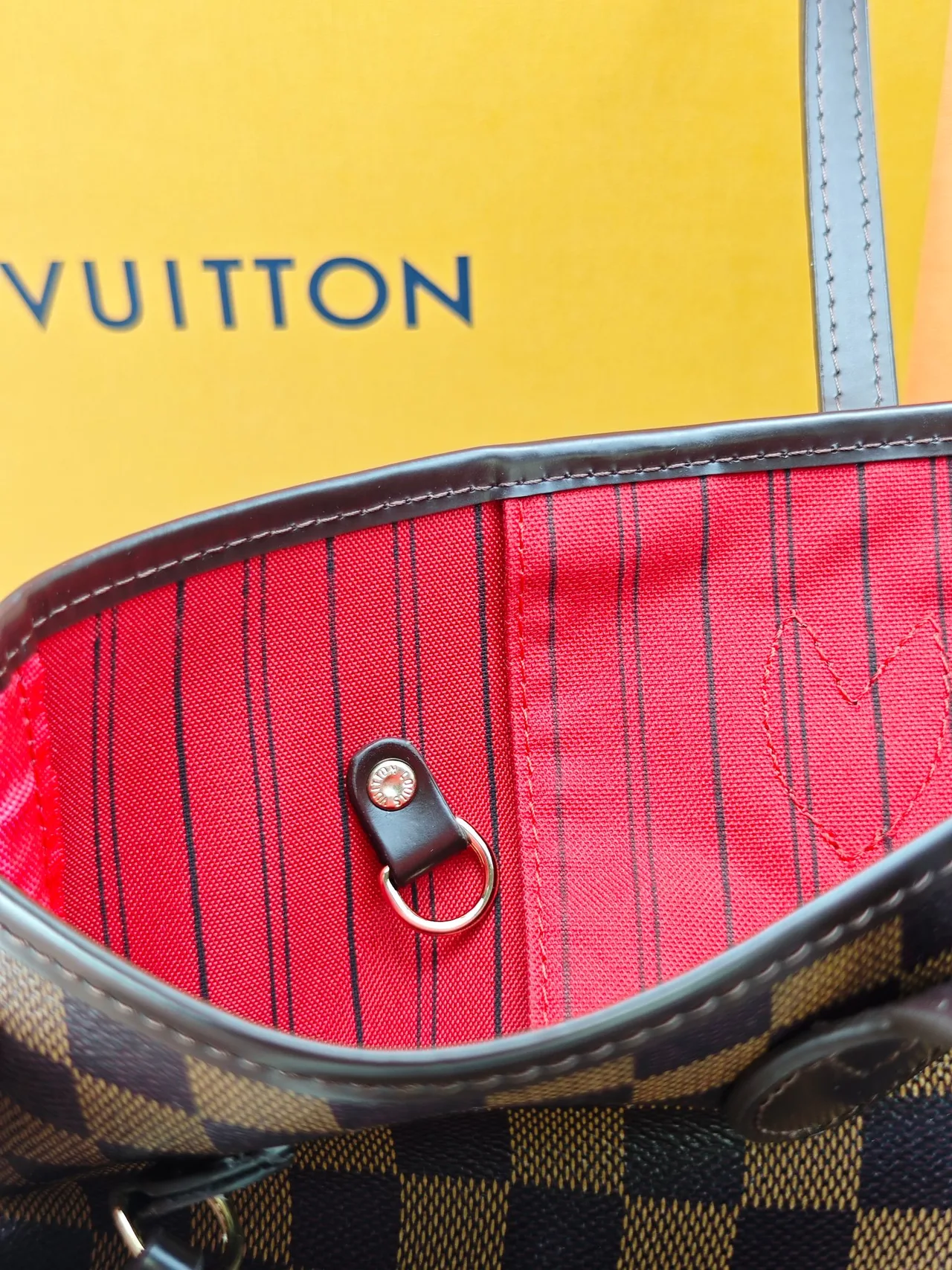 Louis Vuitton Neverfull Clutch in Brown · view 7