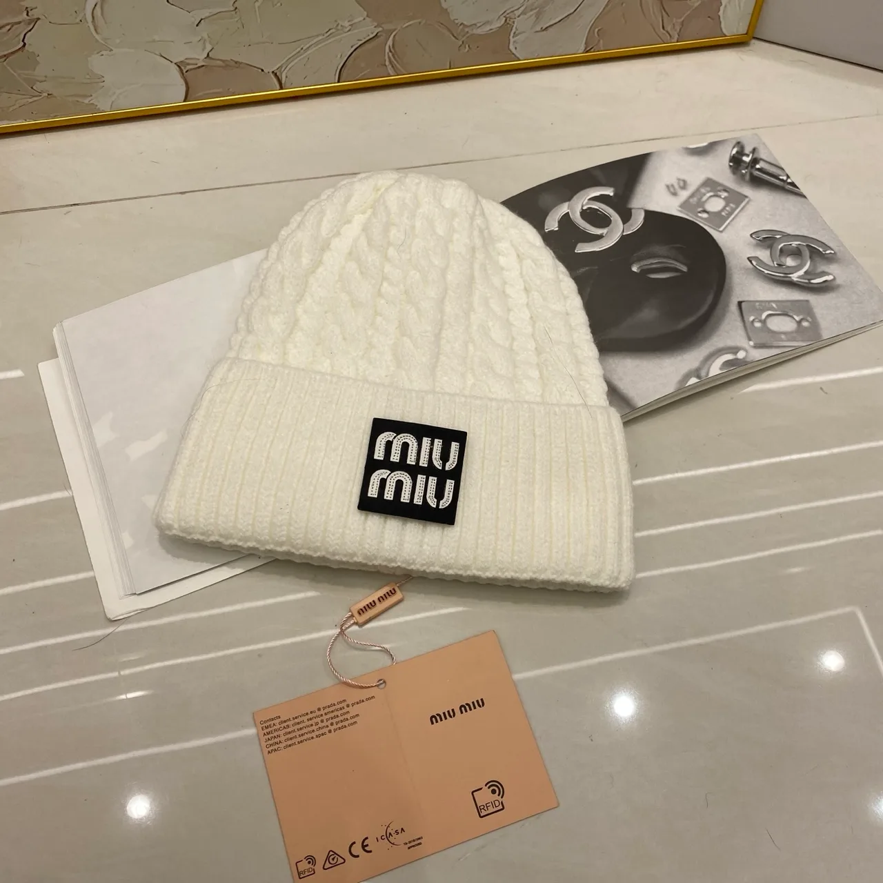 Miu Miu Cable-knit logo beanie in Black & White & Grey & Tan & Cream & Burgundy & Brown · view 2