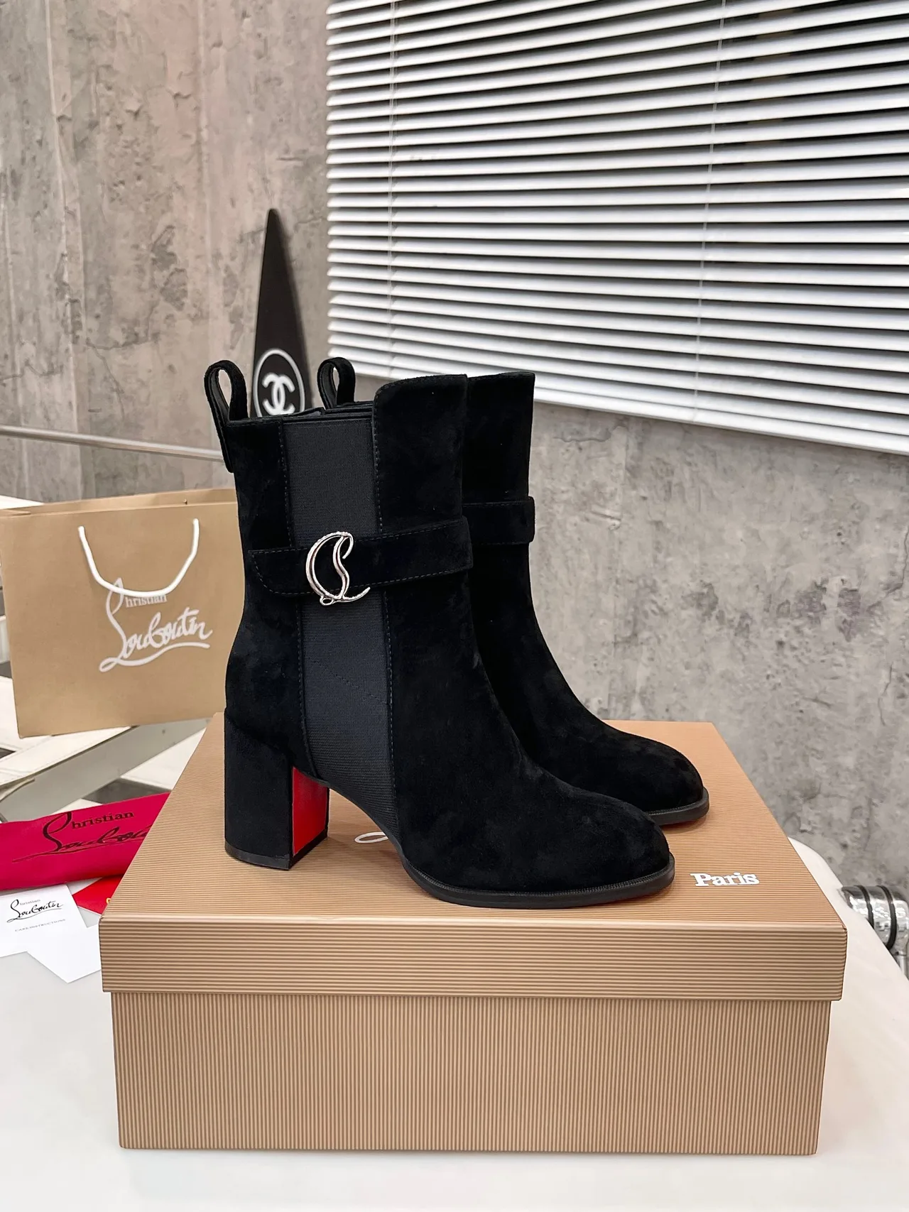 Christian Louboutin Calfskin Suede-Look Pointed-Toe Buckle Ankle Boots in Black · view 1