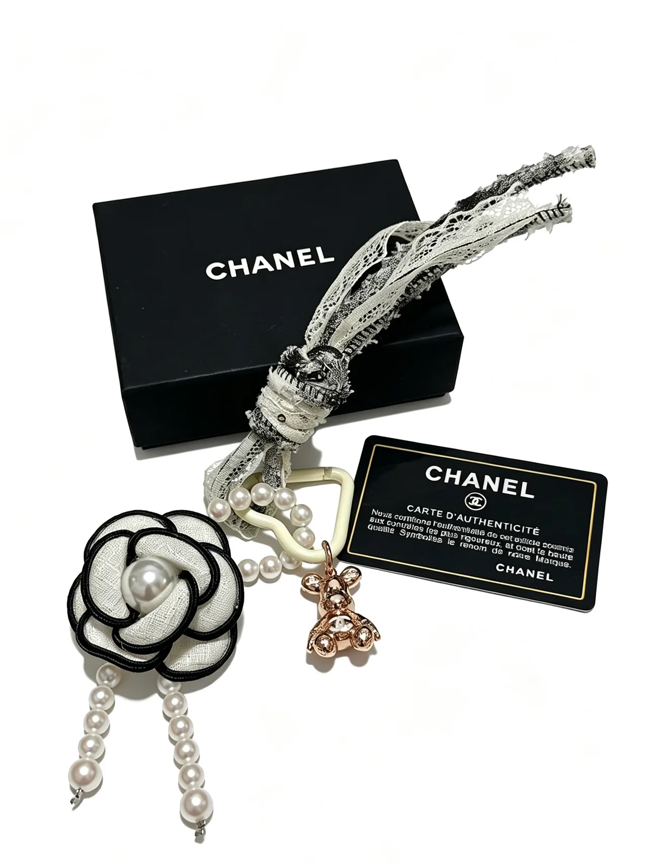 Chanel Glossy Camellia Key Charm in White · view 1