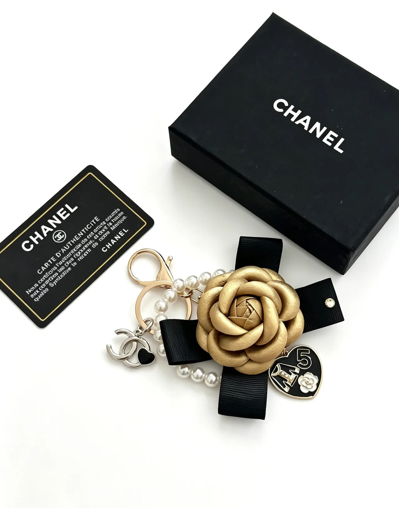 Chanel Glossy Camellia Keychain in Gold · view 2