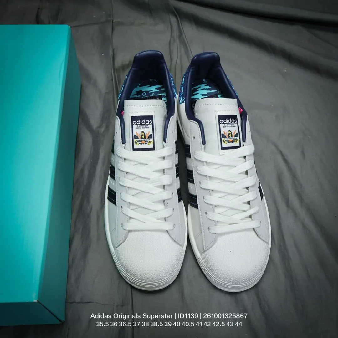 Adidas Striped Low-Top Sneakers in White · view 1