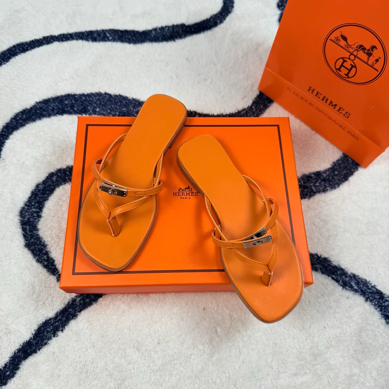 Hermes Denim Leather Flip-Flops in Orange · view 1