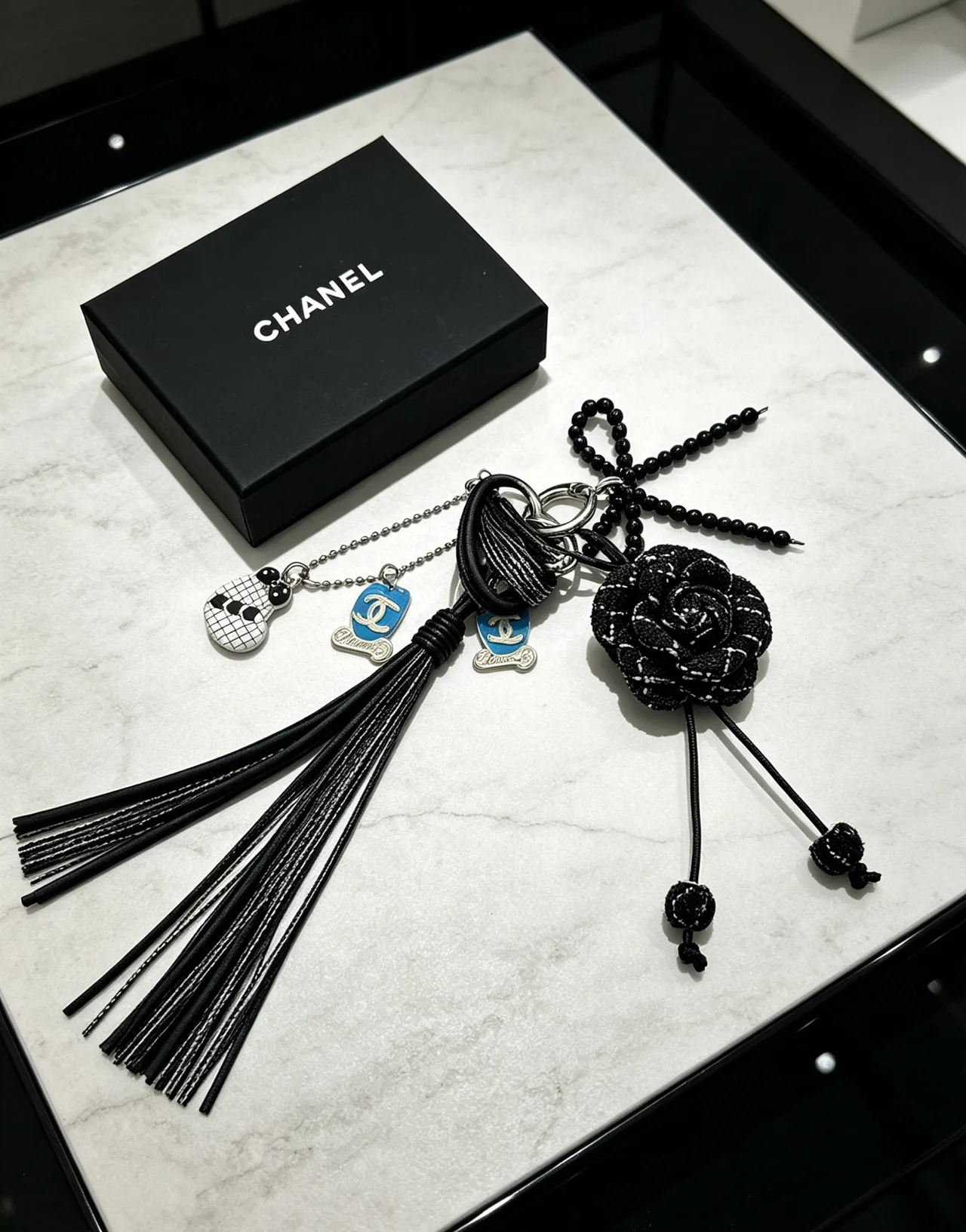Chanel Woven Floral Tassel Keychain in Black · view 6