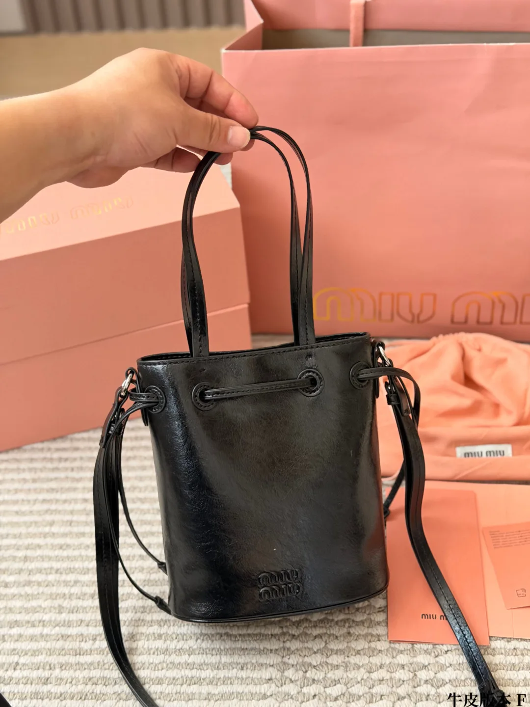Miu Miu Cowhide Bucket Bag in Black · view 1