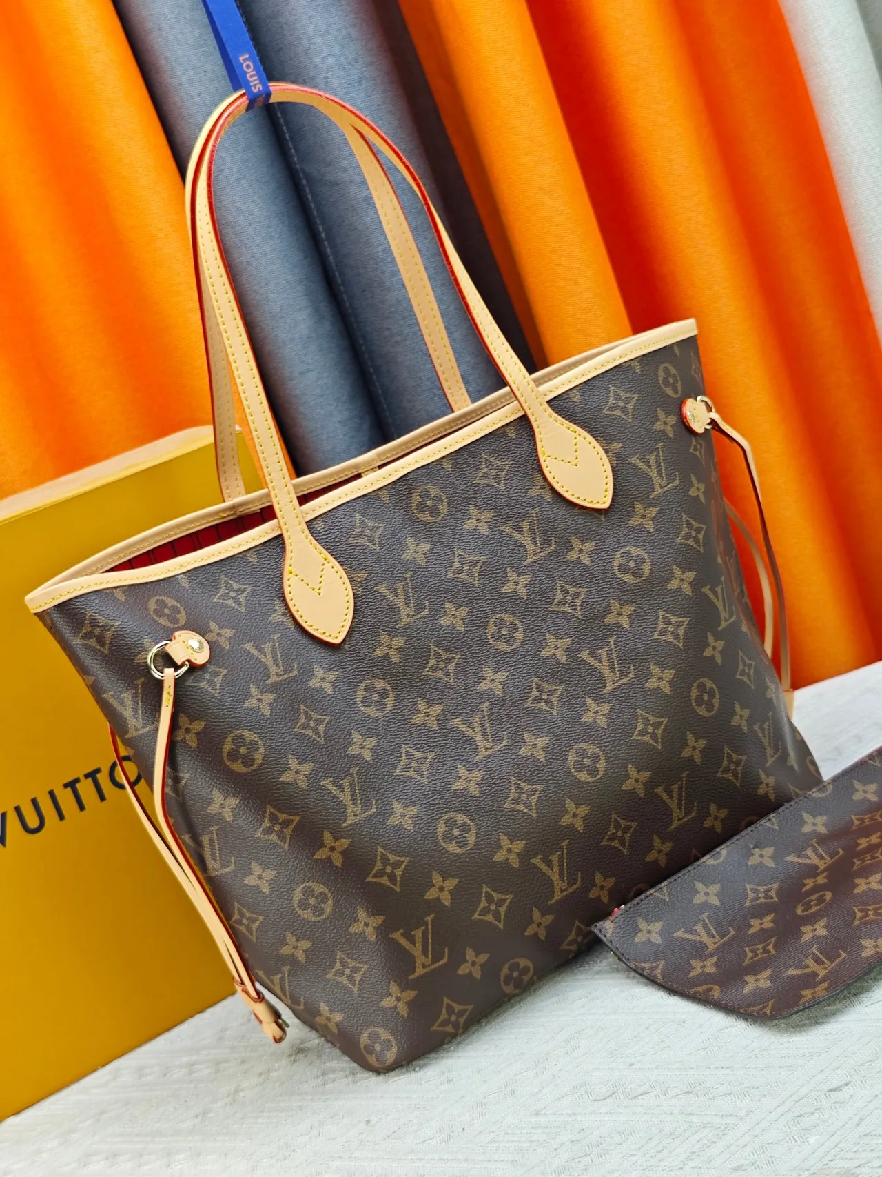 Louis Vuitton Neverfull Clutch in Brown · view 2