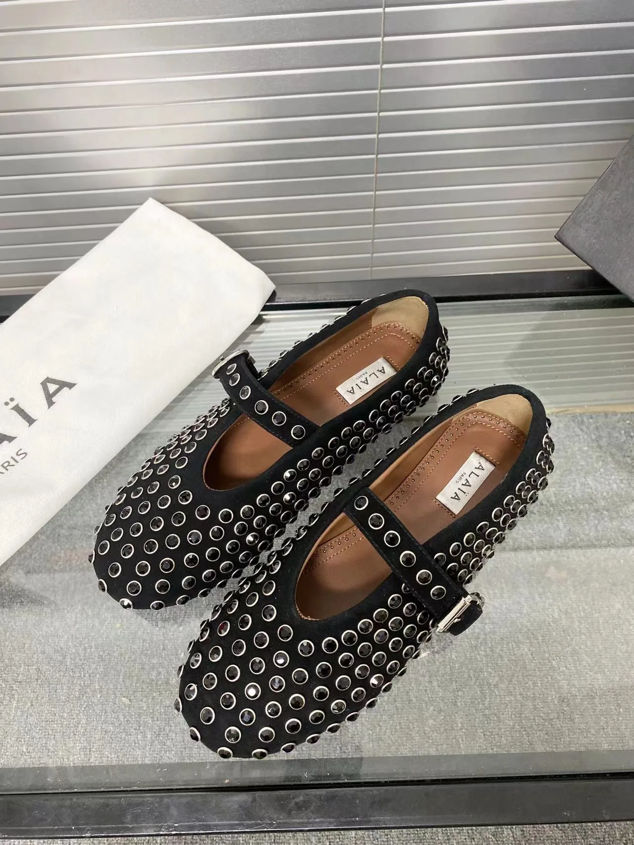 Alaia Cowhide Sheepskin Round-Toe Studded Mary Jane Flats in Black · view 2