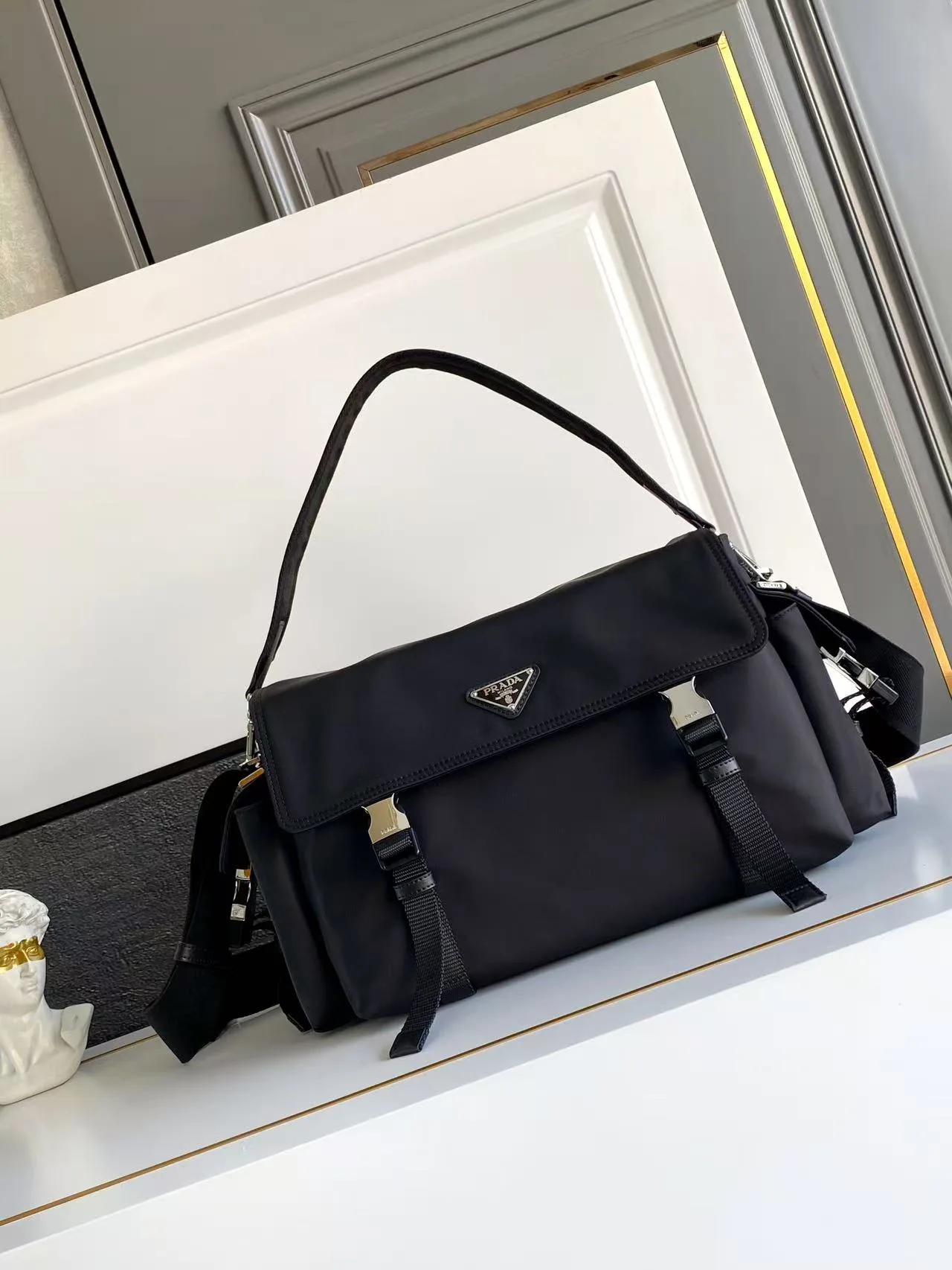 Prada Buckle-Detail Flap Shoulder Bag in Black · view 1