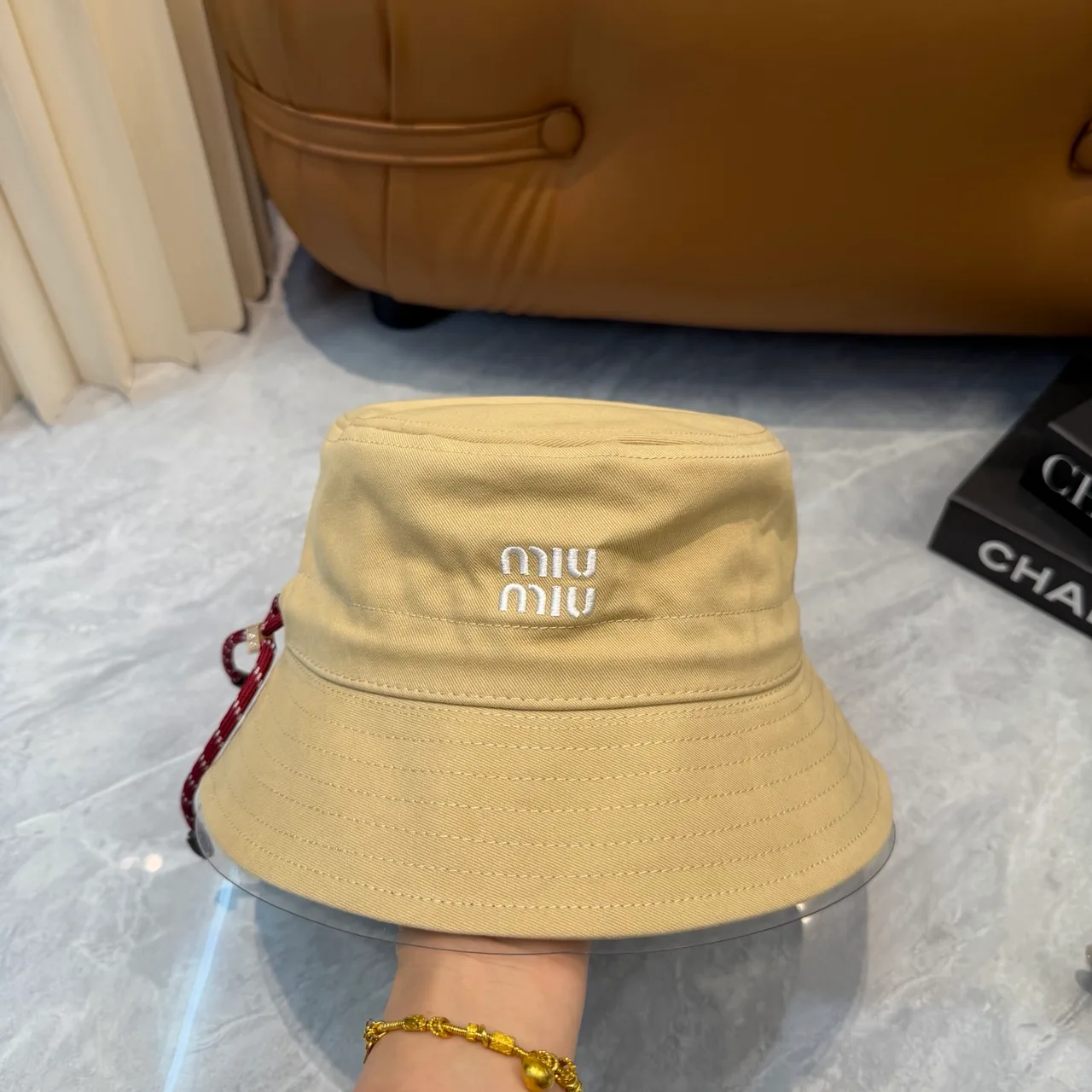 Miu Miu Bucket Hat in Beige · view 1