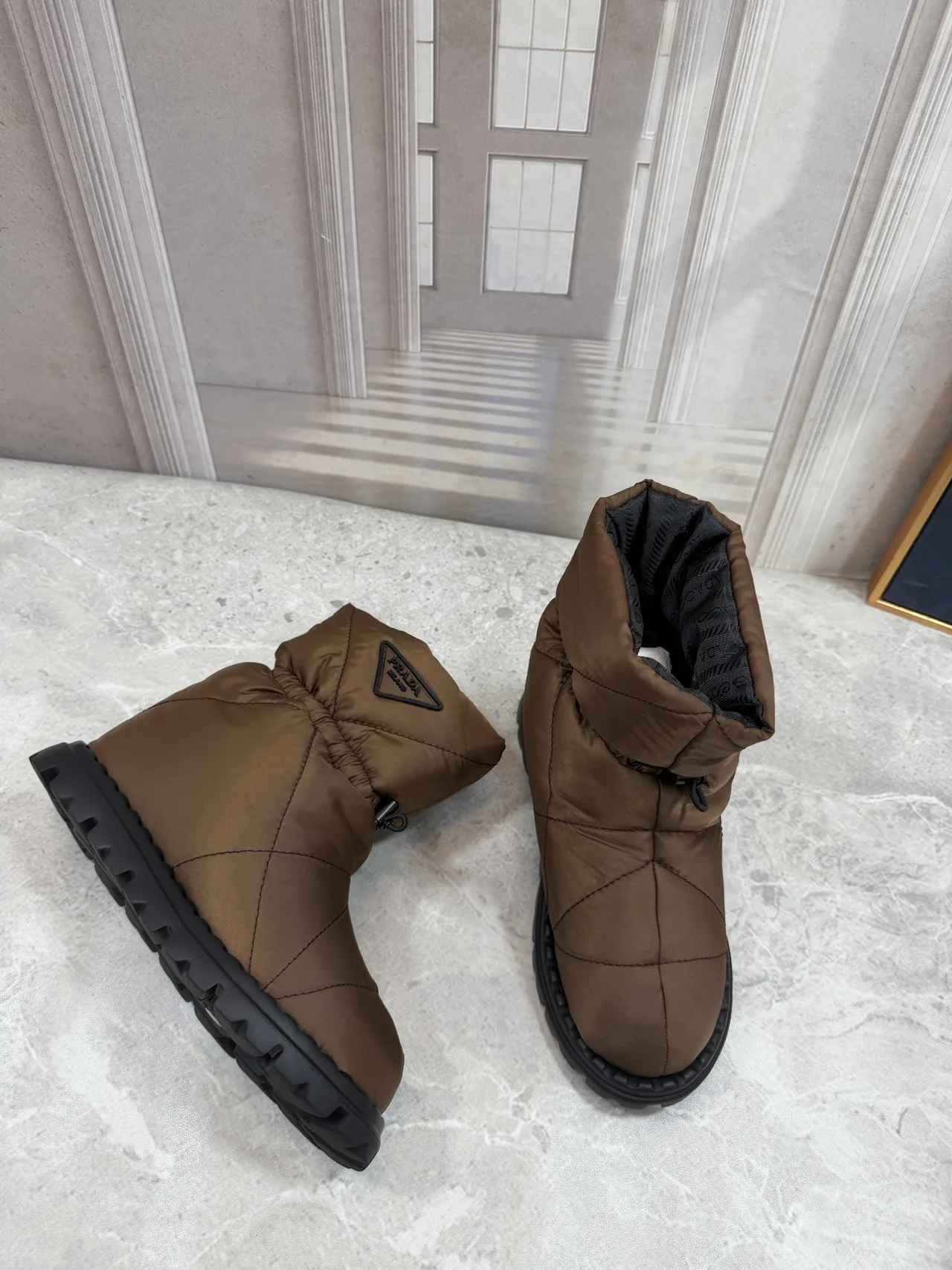 Prada Quilted Round-Toe Puffer Boots in Brown · view 2
