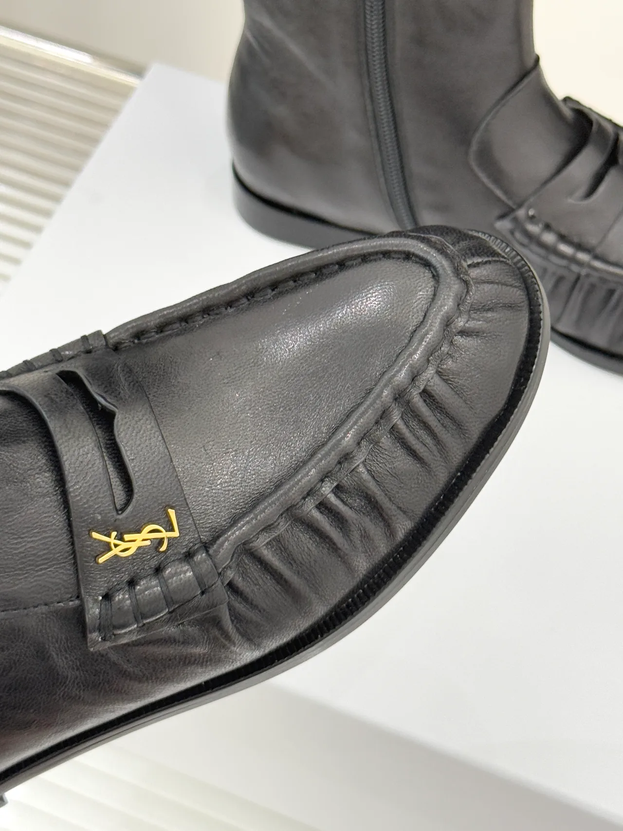 Saint Laurent Glossy Round-Toe Loafer Ankle Boots in Black · view 7