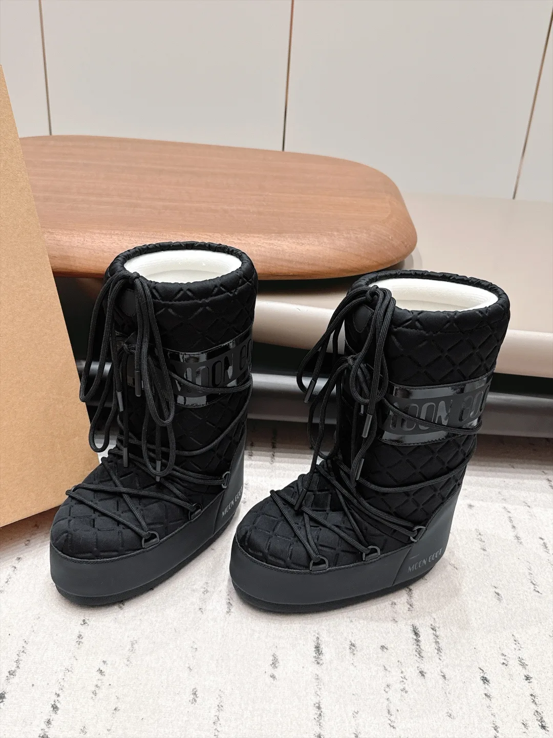 Moon Boot Glossy Quilted Snow Boots in Black · view 2