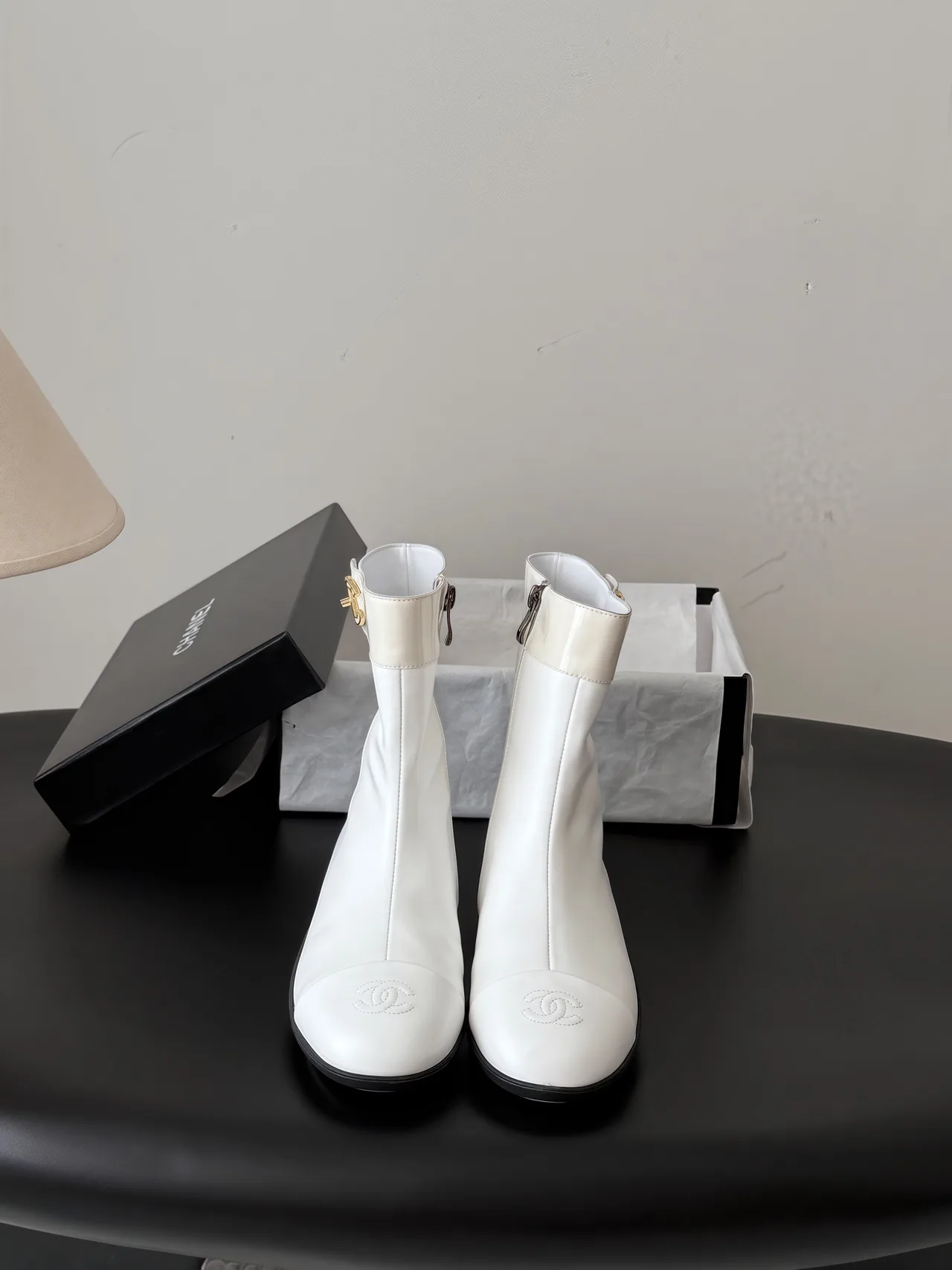 Chanel Cowhide Glossy Ankle Boots in White · view 1