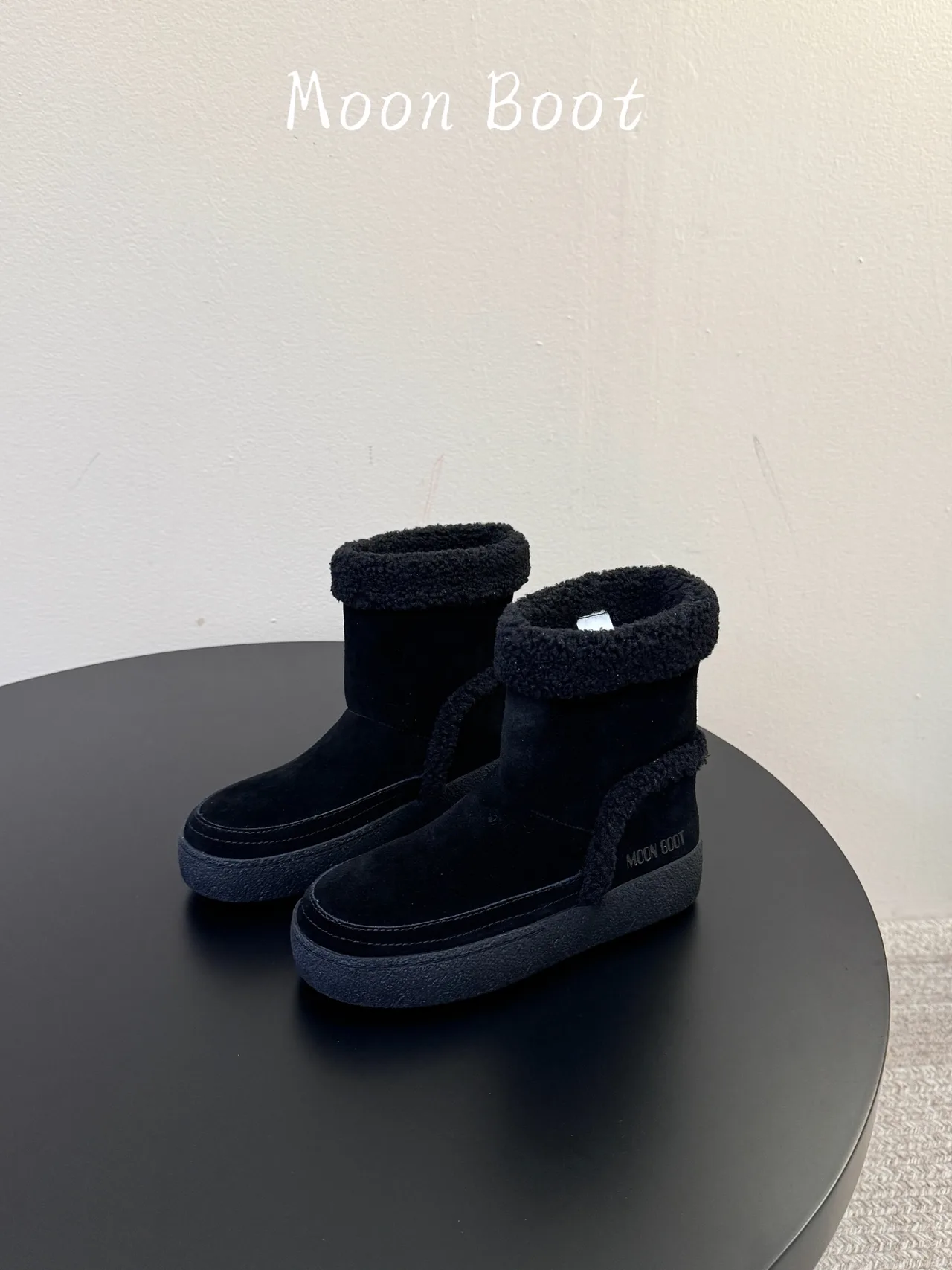 Moon Boot Cowhide Ankle Boots in Black · view 1
