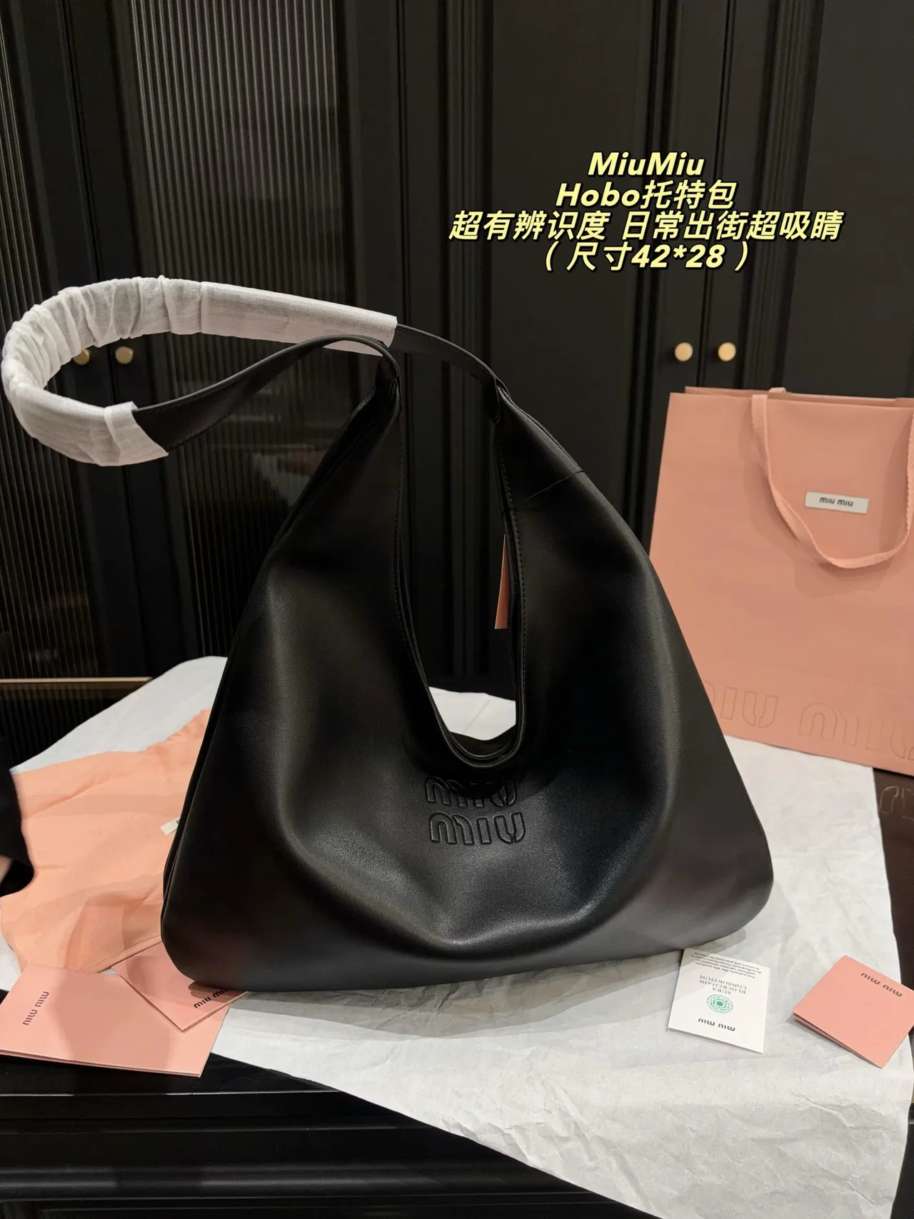 Miu Miu Cowhide Glossy Hobo Bag in Black · view 1