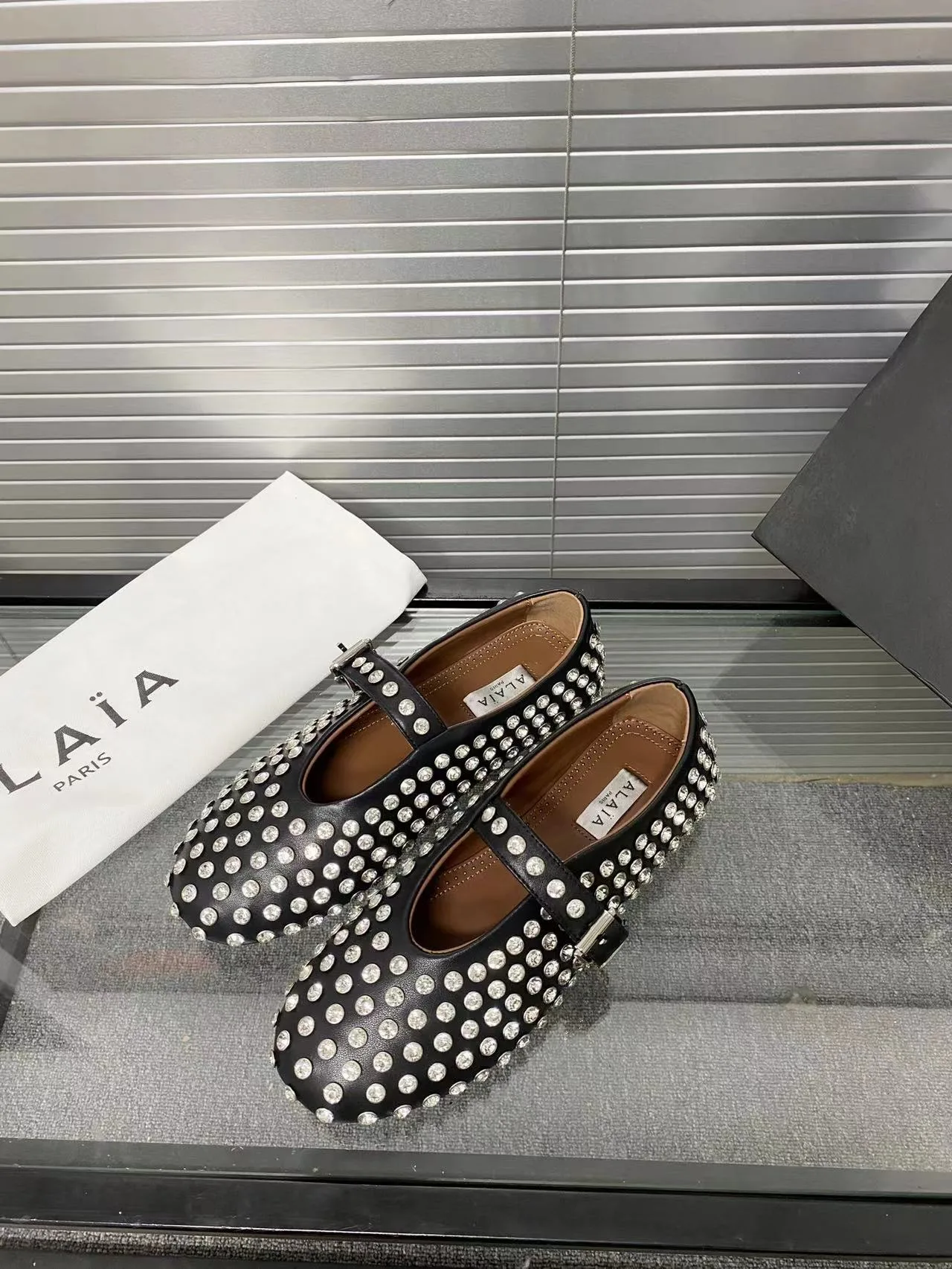 Alaia Cowhide Sheepskin Buckle Studded Mary Jane Flats in Black · view 3