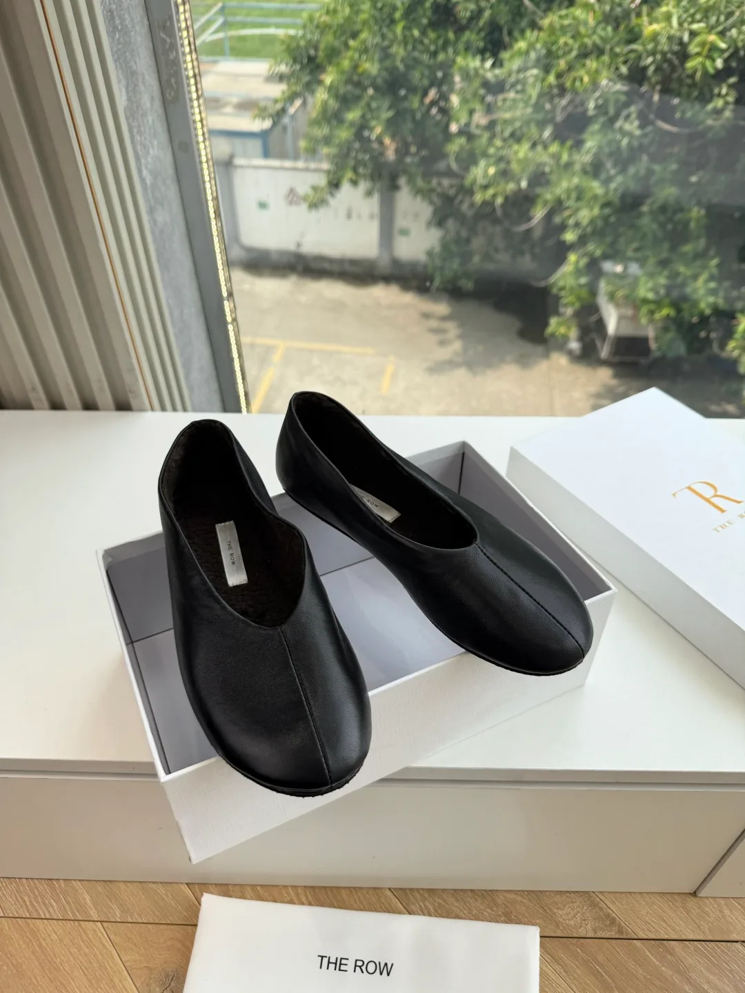 The Row Cowhide Smooth Round-Toe Ballet Flats in Black · view 8