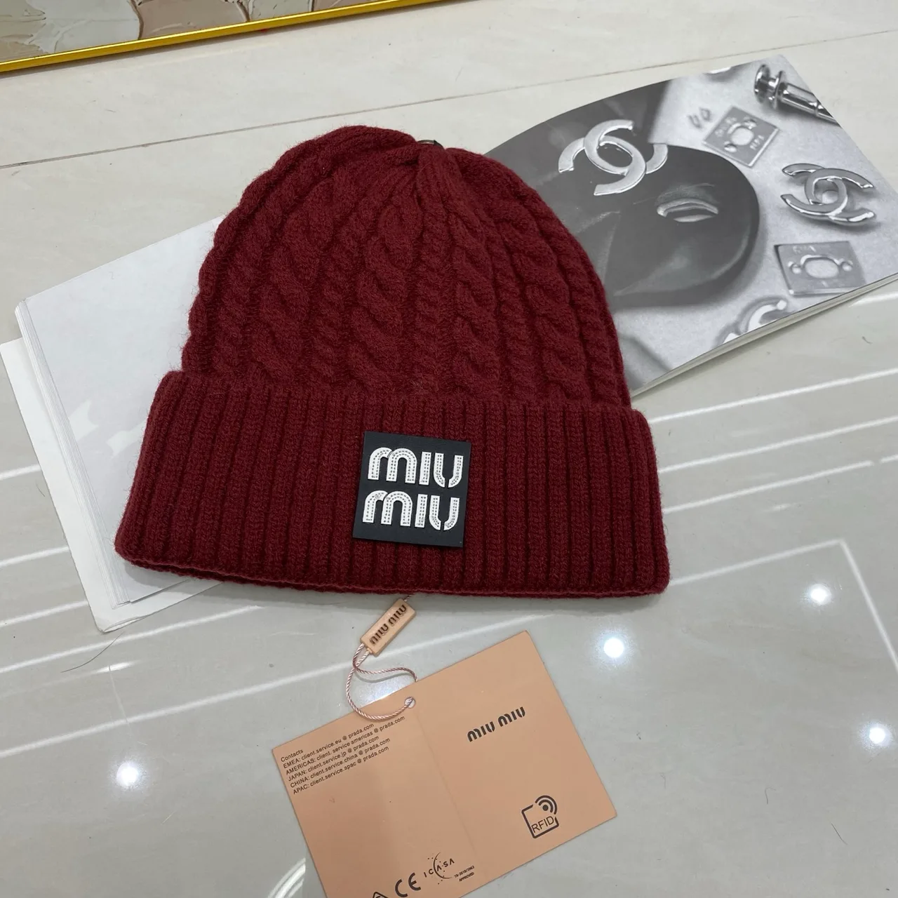 Miu Miu Cable-knit logo beanie in Black & White & Grey & Tan & Cream & Burgundy & Brown · view 6