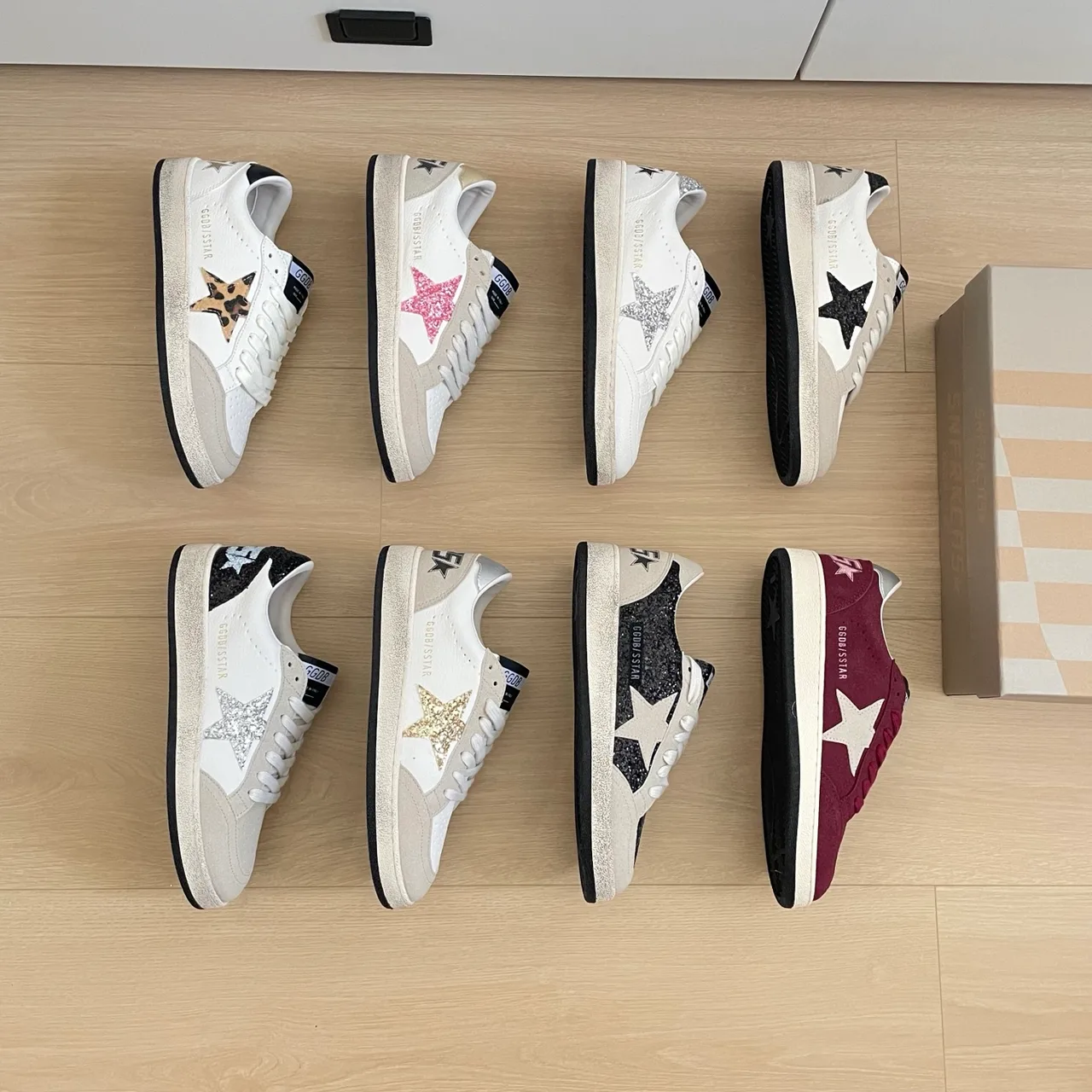 Golden Goose Star Low-Top Sneakers in White / Black / Burgundy · view 1