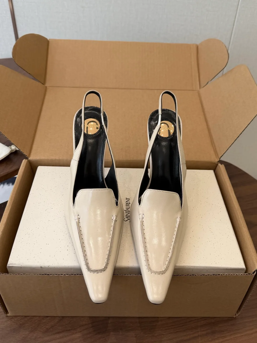 Saint Laurent Cowhide Pointed-Toe Slingback Shoes in Cream · view 1