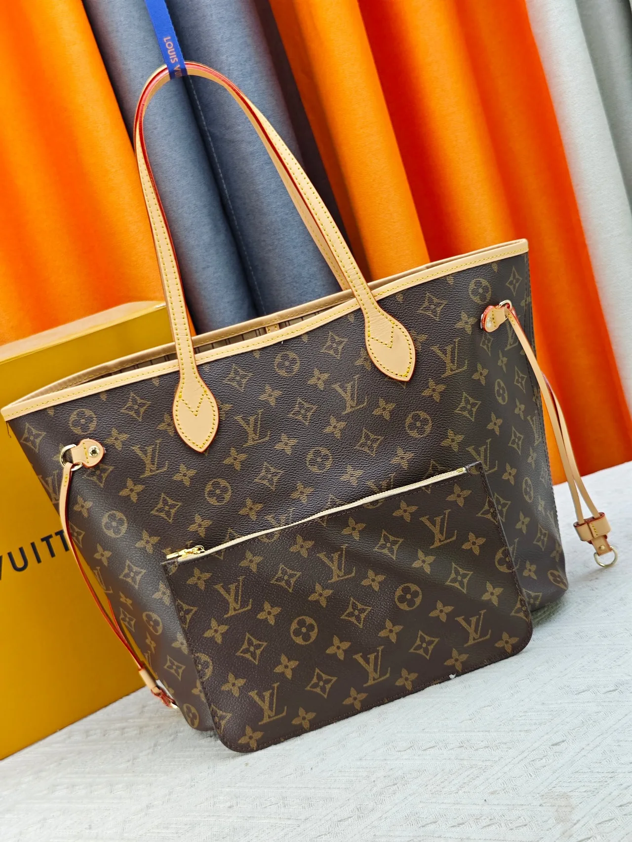 Louis Vuitton Neverfull Clutch in Brown · view 1