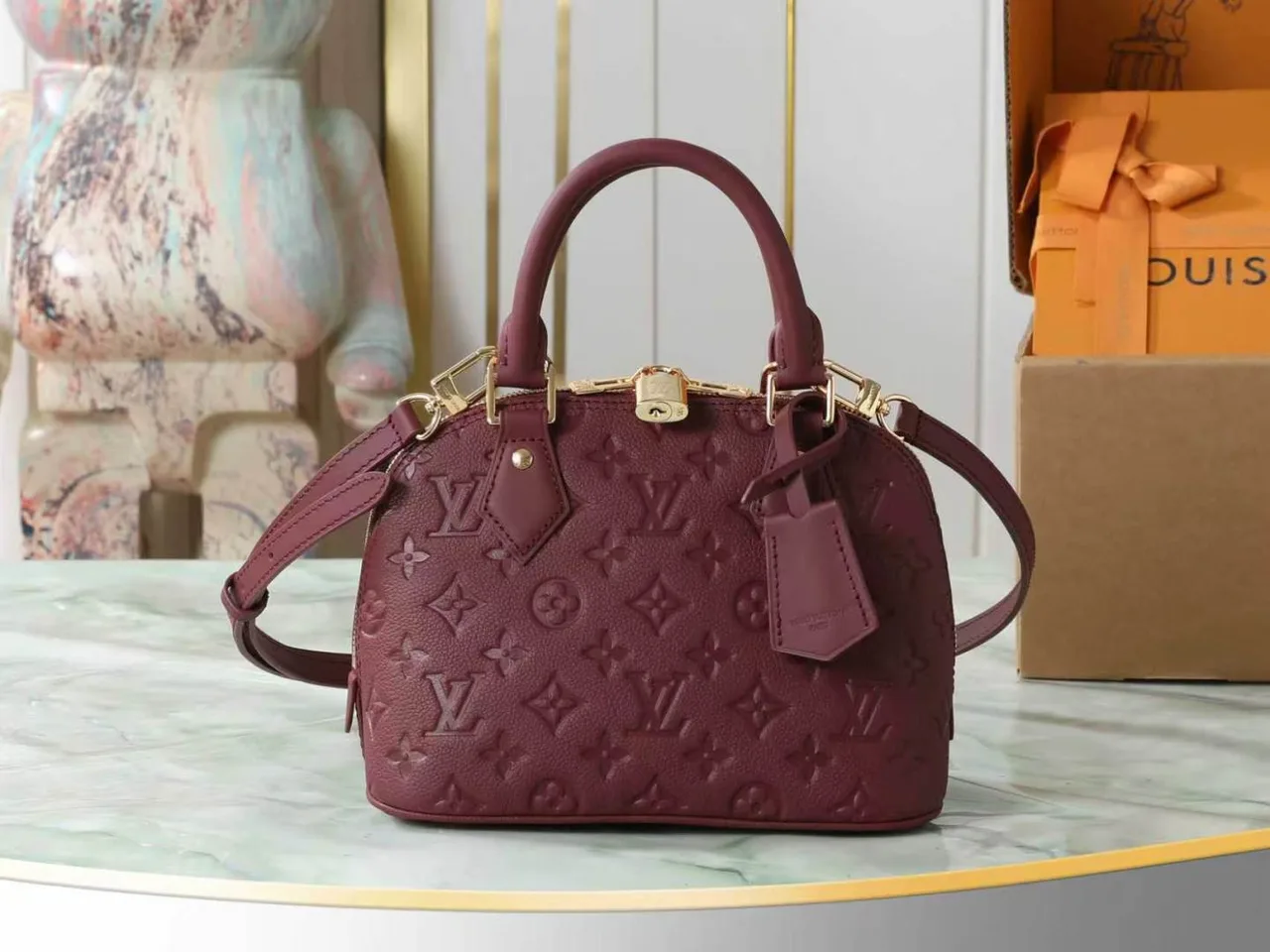 Louis Vuitton Leather Quilted Top-Handle Bag in Burgundy · view 1